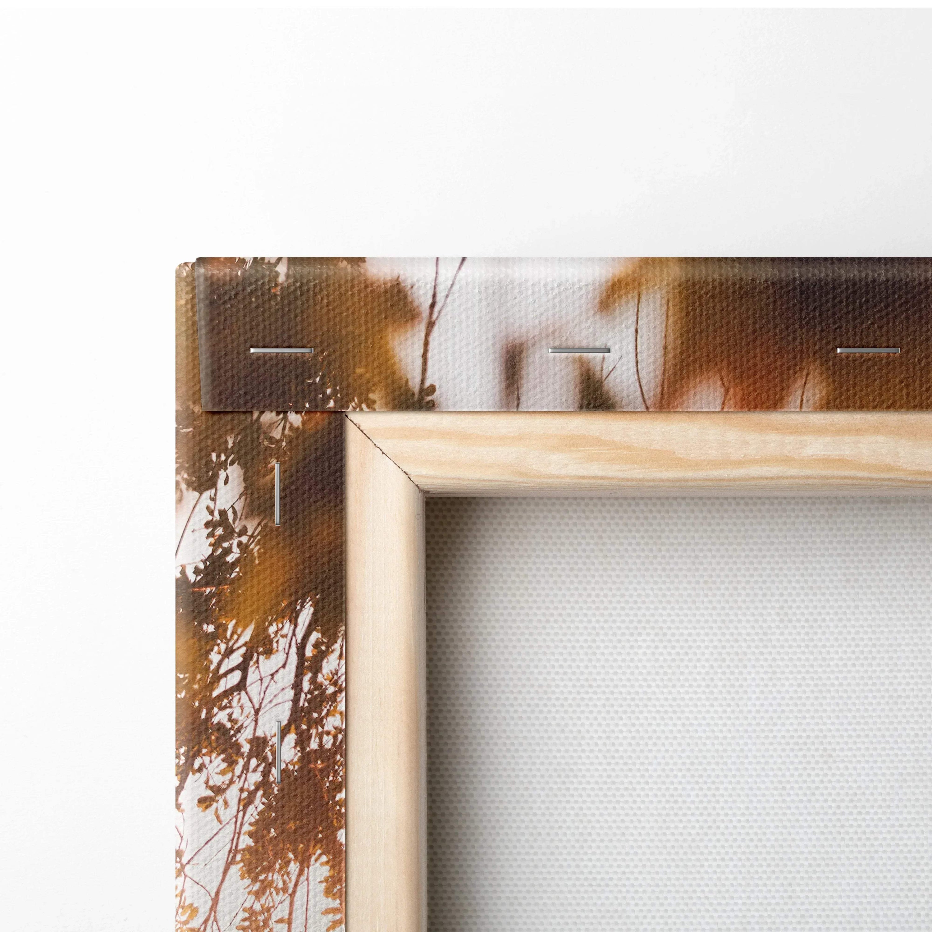 Close-up of natural wood frame corner and textured canvas for vertical canvas art wall decor.