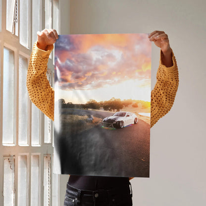 Sunset-lit Nissan 370z on road poster wall art with vibrant sky colors.