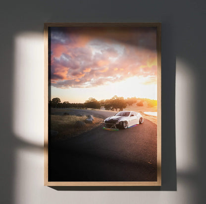 Nissan 370z poster wall art with car on road at sunset and colorful sky background.