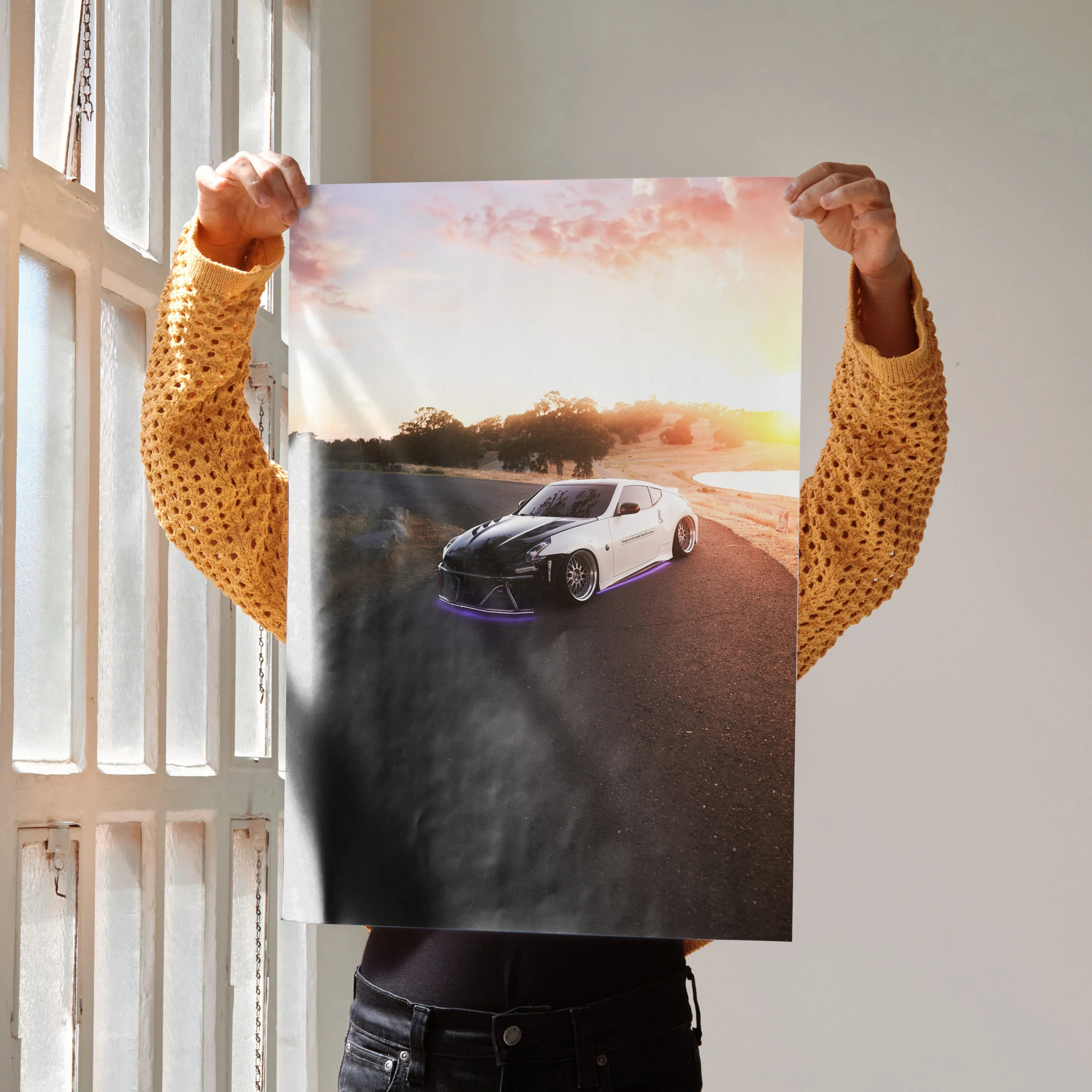 Nissan 370z parked on road at sunset with warm sky colors poster wall art.