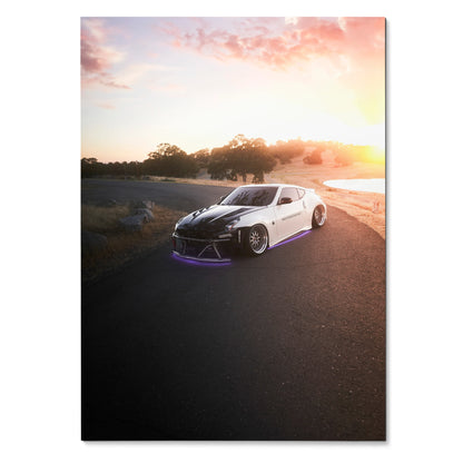 Nissan 370z parked on coastal road at sunset poster wall art with soft pink sky.