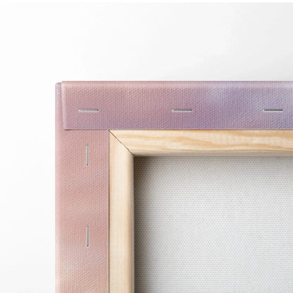 Close-up of stretched canvas corner with visible wood frame and staples on wall art print.