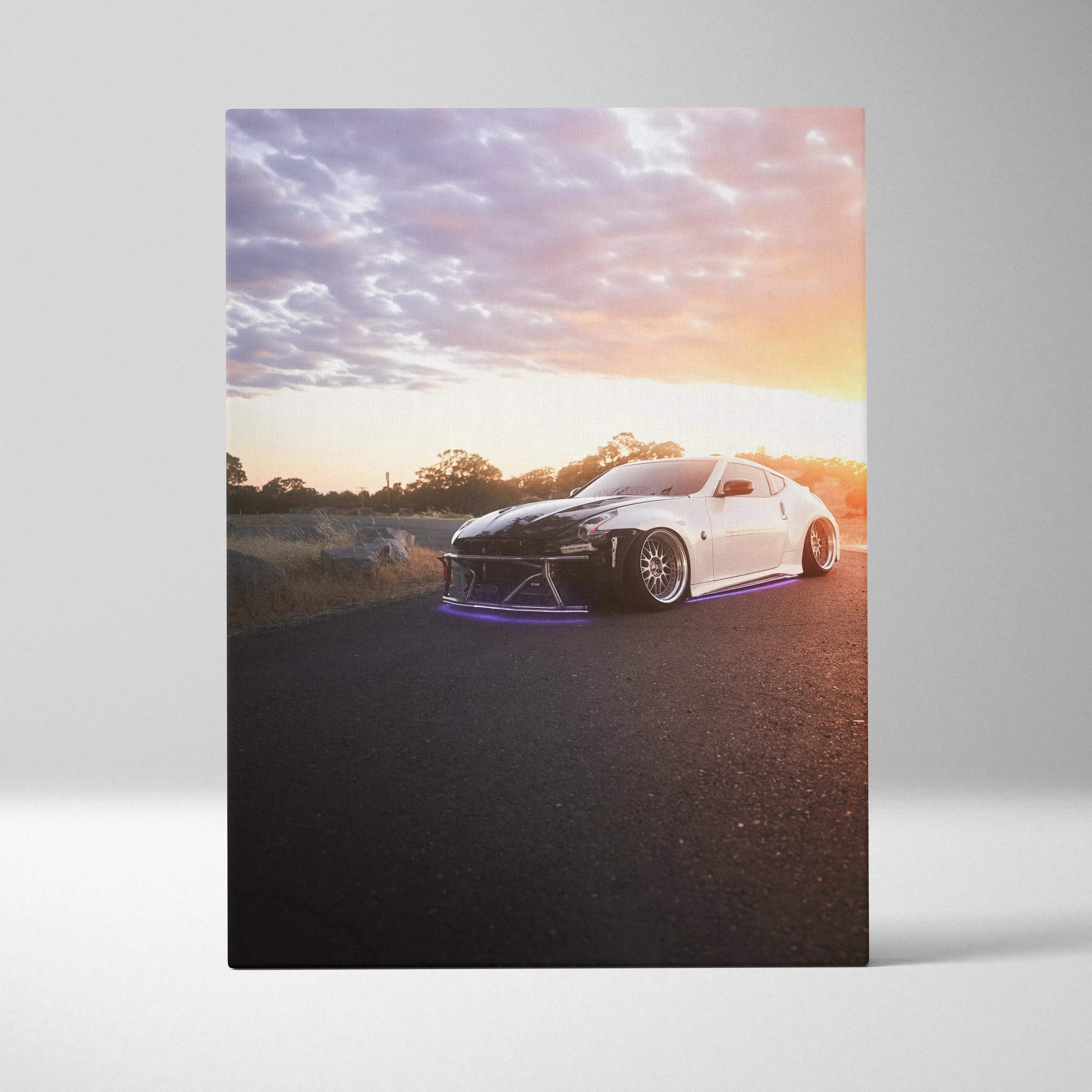 Canvas wall art featuring a white and black nissan 370z with lowered suspension and purple underglow lights vertical print