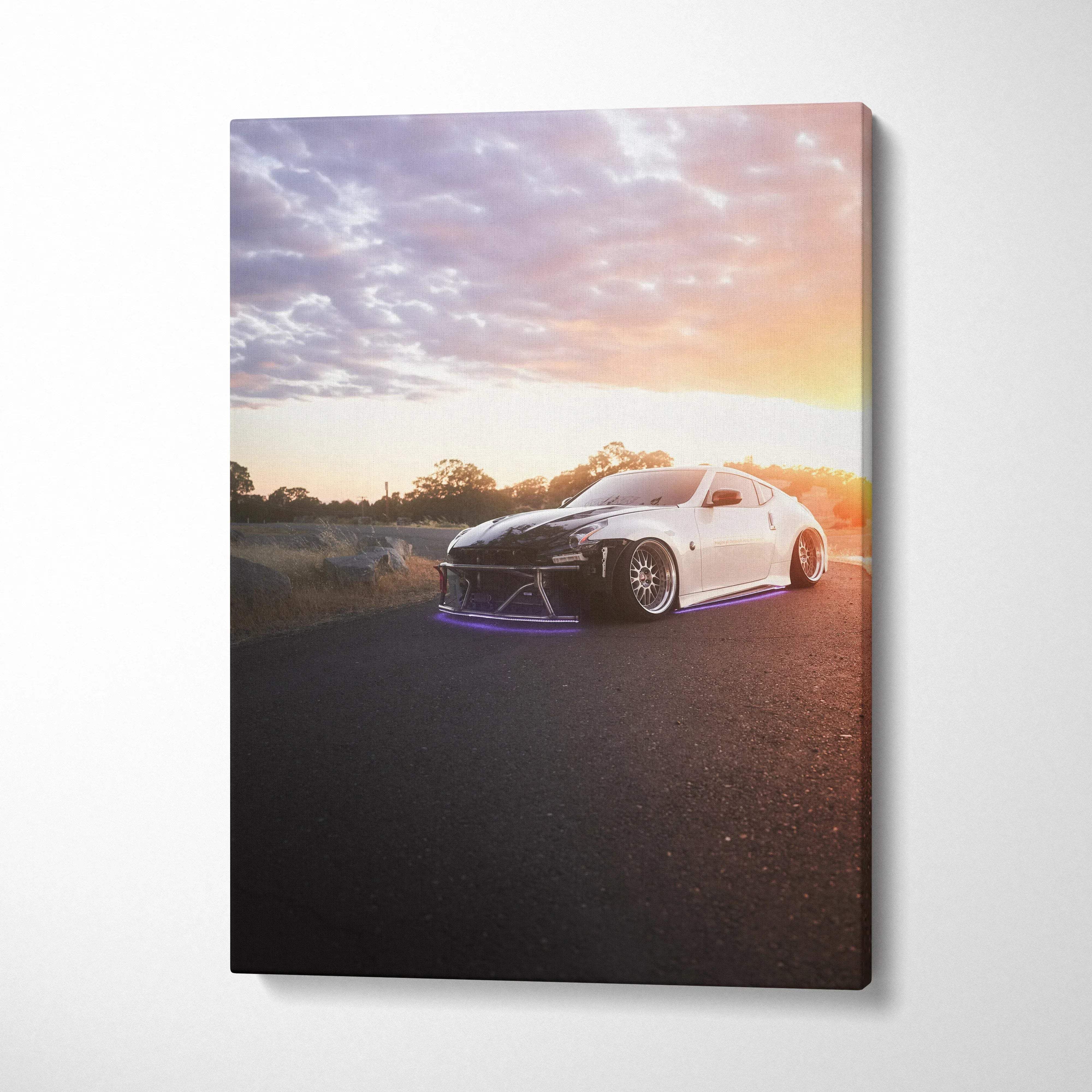 Nissan 370z at sunset on asphalt road canvas wall art with vibrant sky colors.