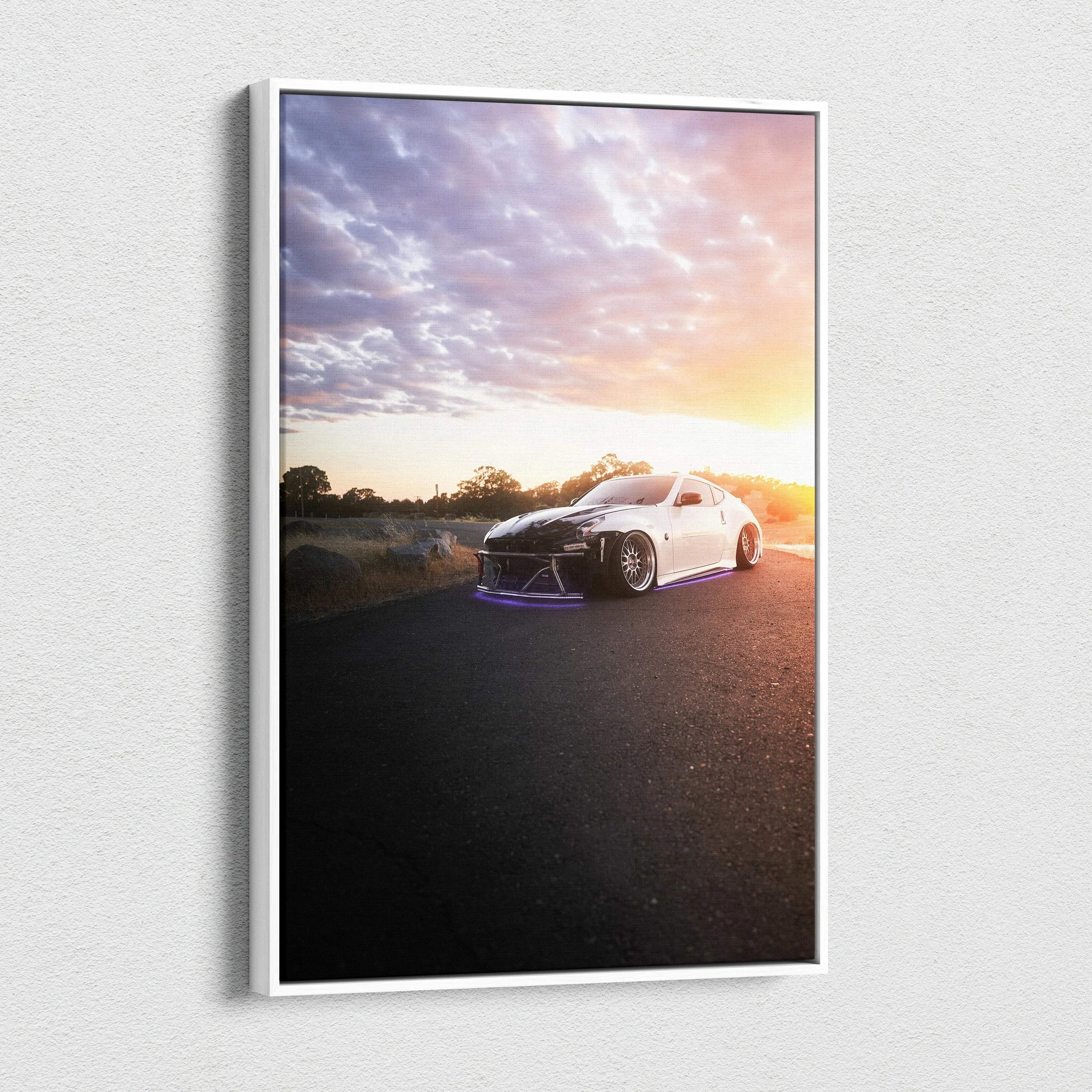 White Nissan 370z parked on road at sunset with dramatic sky canvas wall art.