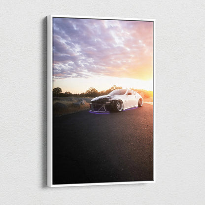 White Nissan 370z parked on road at sunset with dramatic sky canvas wall art.