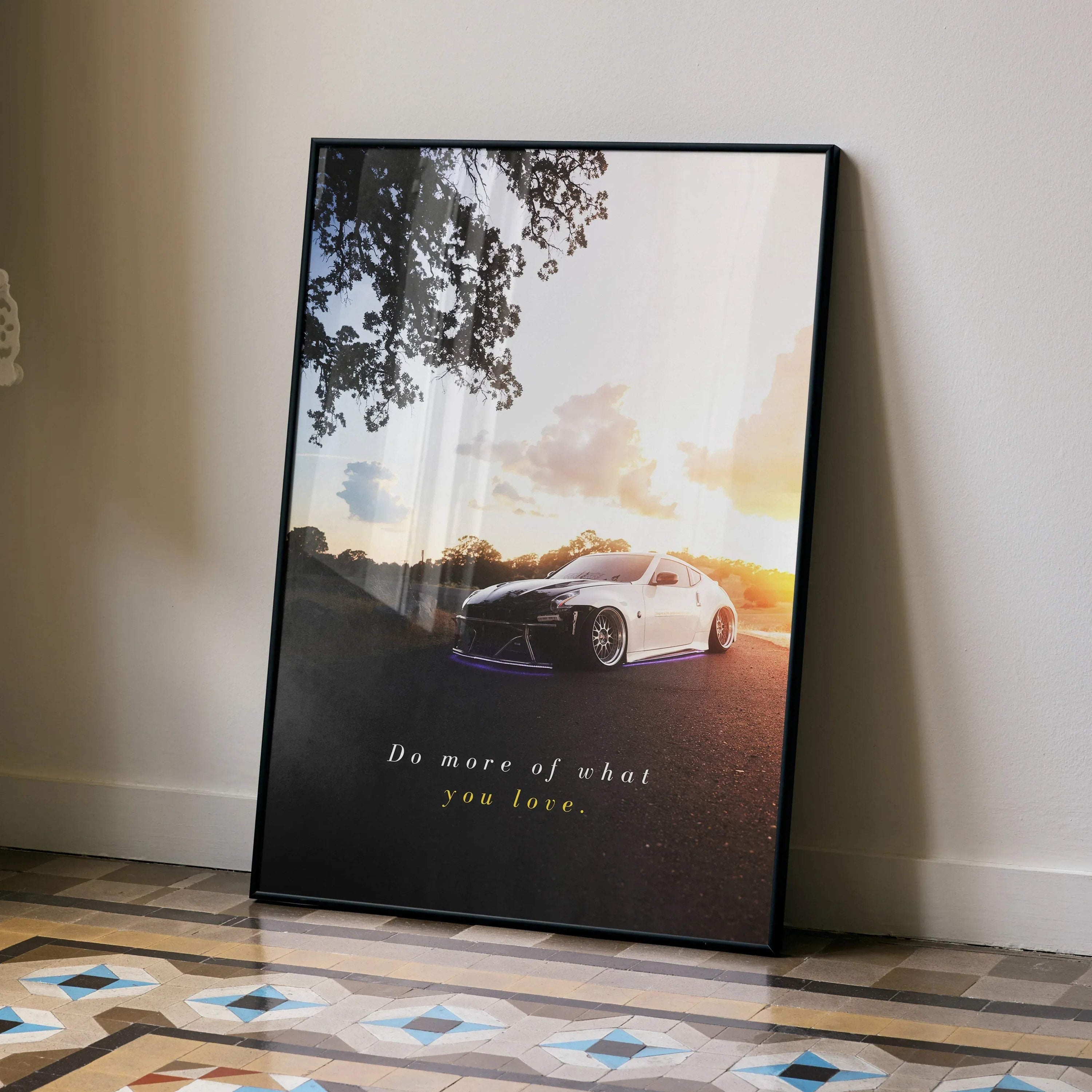 Motivational poster wall art featuring white Nissan 370z at sunset with inspiring text.