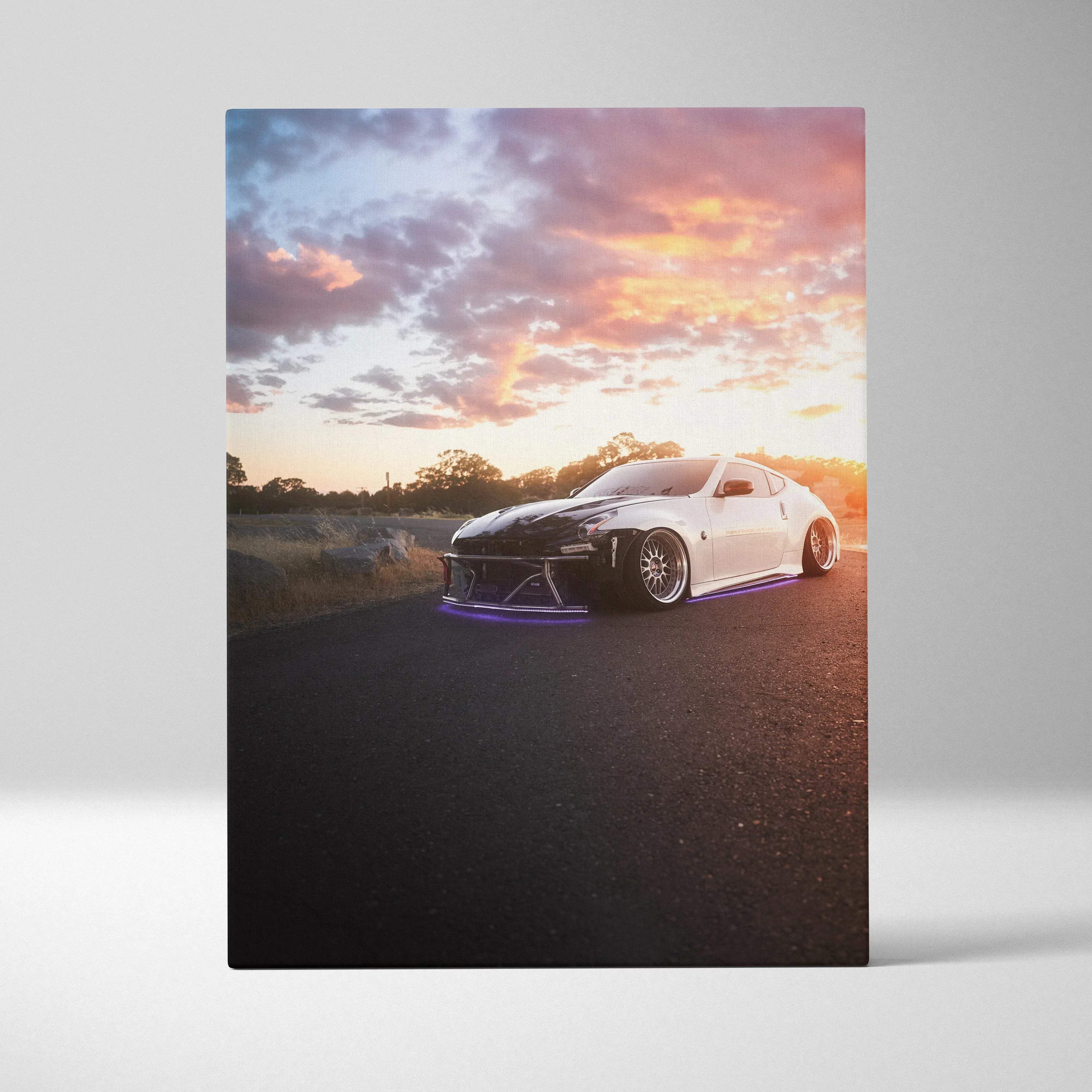 Canvas wall art featuring automotive photography of a white and black nissan 370z with purple underglow lights at sunset