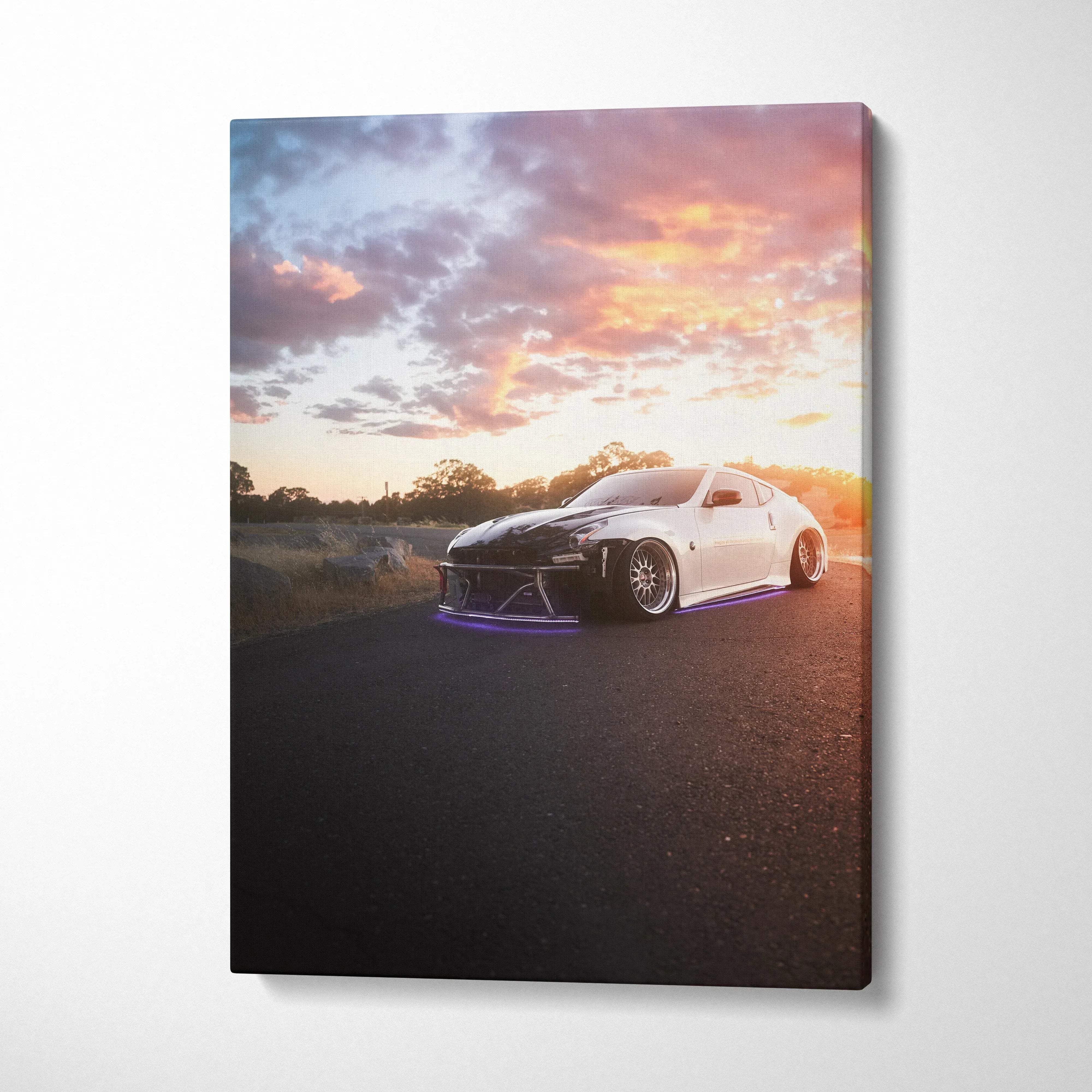 White Nissan 370z on road at sunset with dramatic sky on vertical canvas wall art.