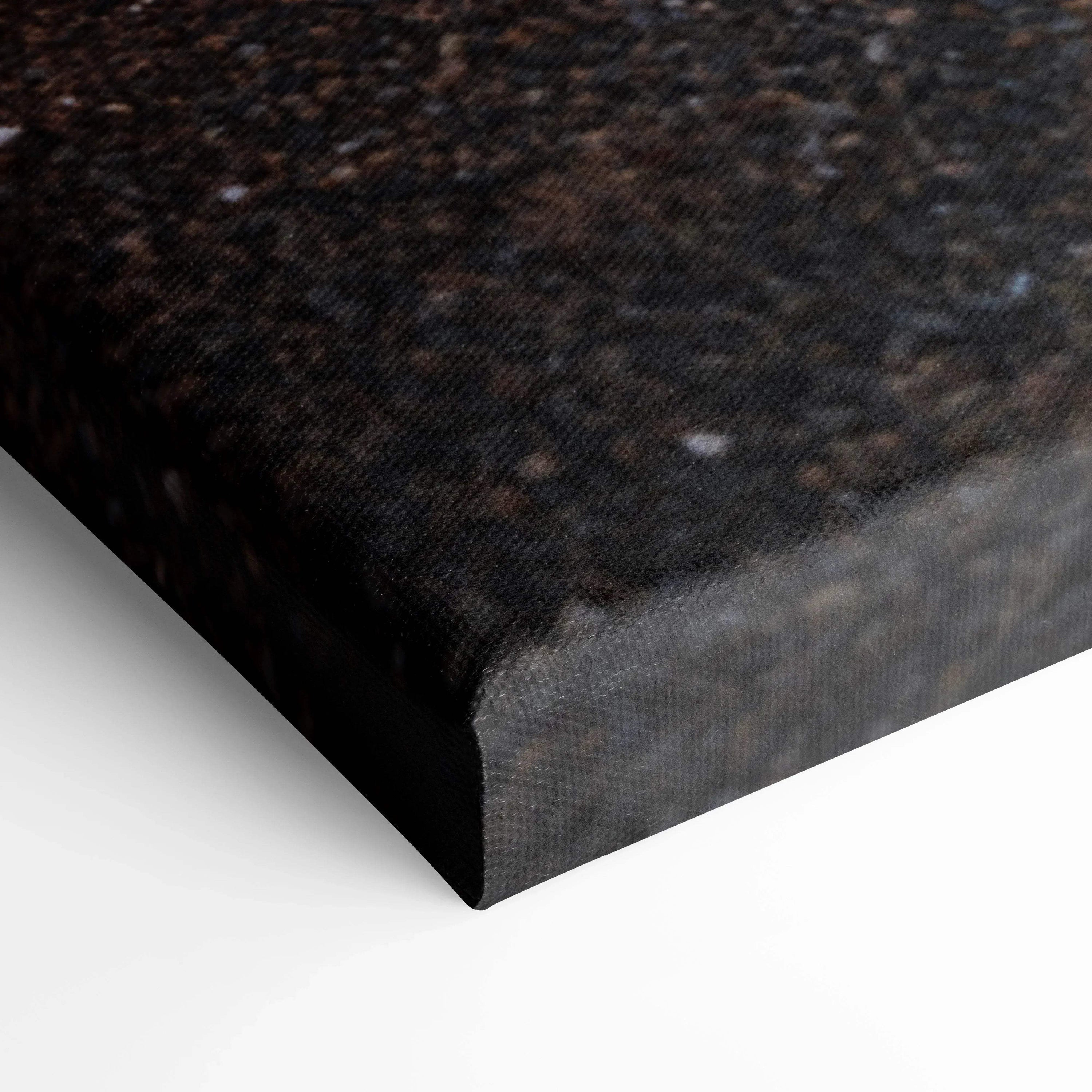 Close-up of textured black canvas art corner with fine grain detail and sharp edges for wall art display.