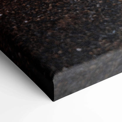 Close-up of textured black canvas art corner with fine grain detail and sharp edges for wall art display.
