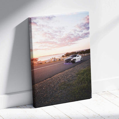 Sunset road scene with white Nissan 370z car on vertical canvas wall art.