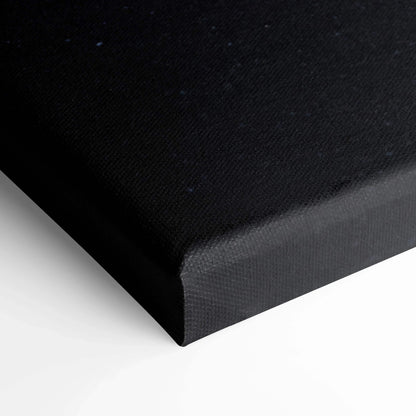 Black stretched canvas corner showcasing texture and tight corner fold for wall art display.