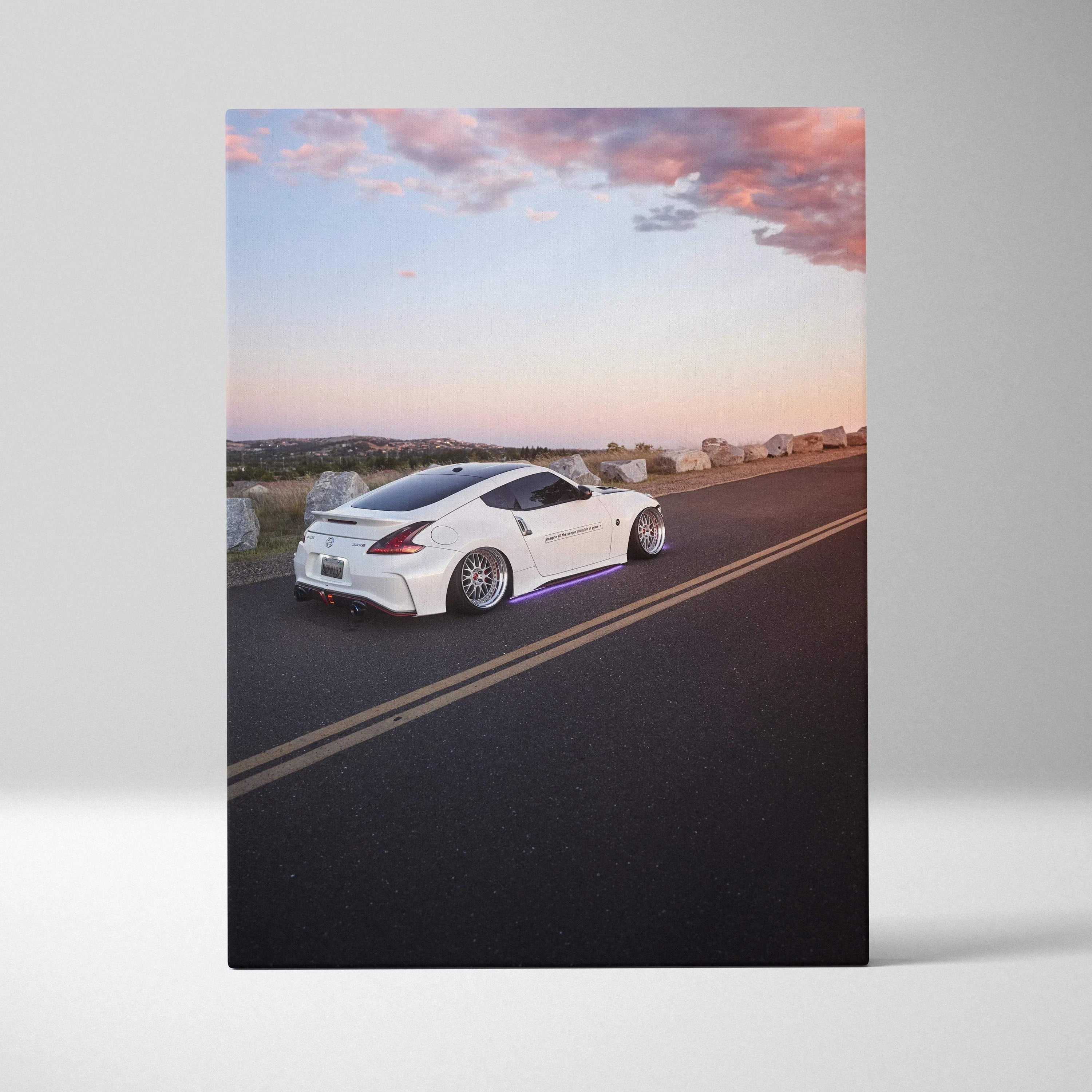 Nissan 370z white sports car on road at sunset high resolution vertical canvas wall art.