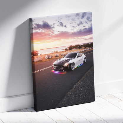 Nissan 370z driving at sunset on coastal road vertical canvas wall art print.