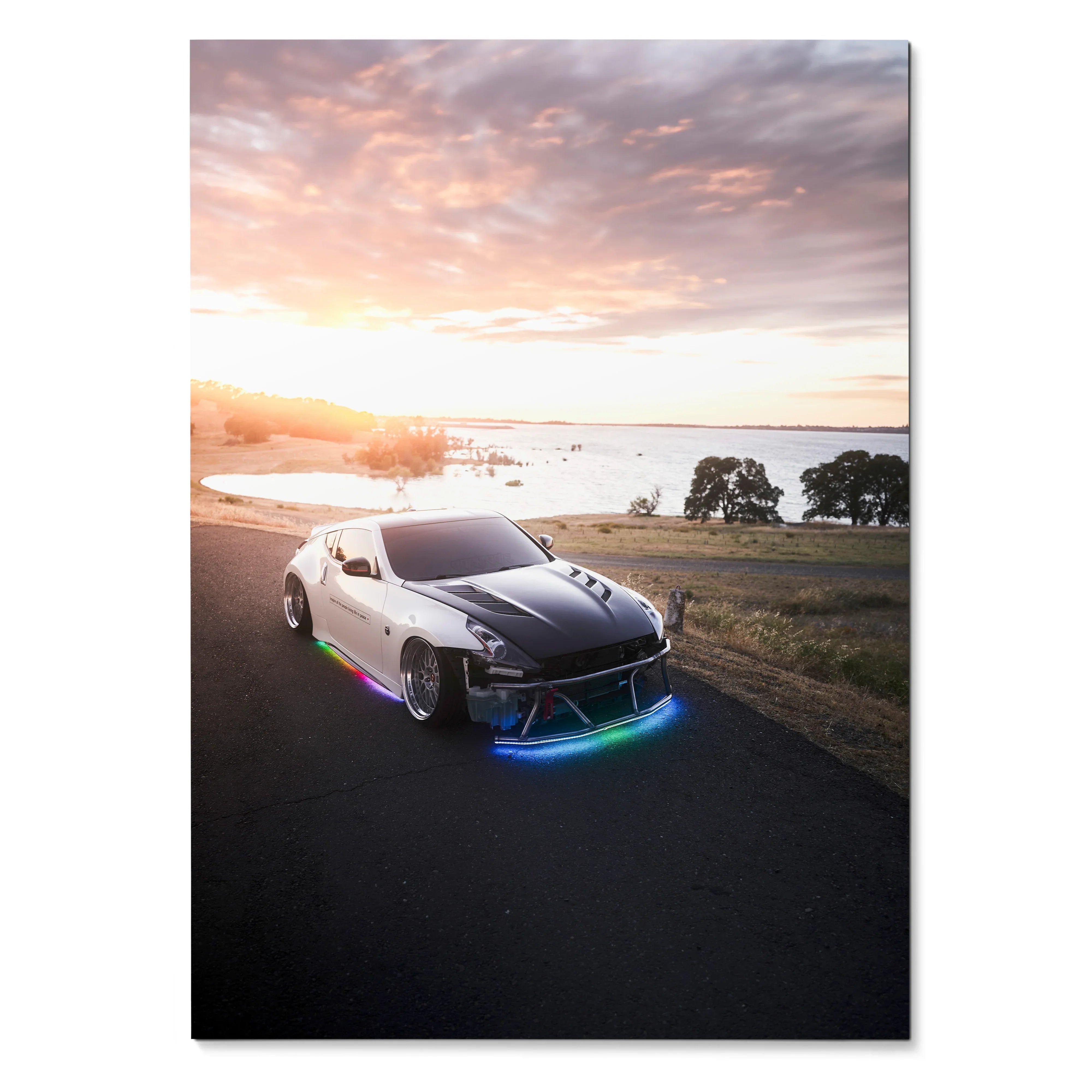 Nissan 370z with neon underglow on coastal road at sunset poster wall art.