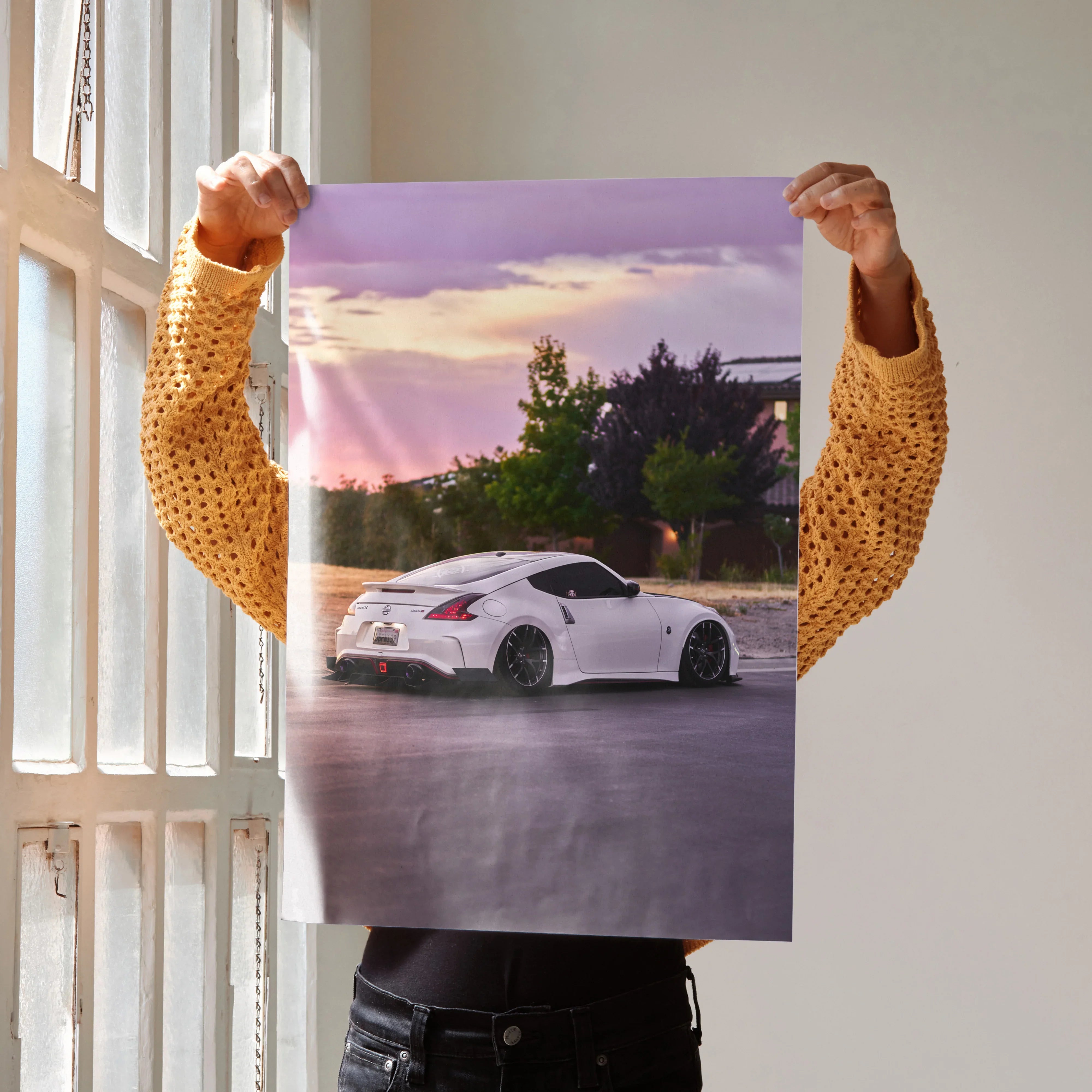 White Nissan 370z parked at sunset with purple sky poster wall art.