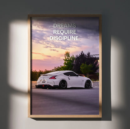 Motivational poster wall art featuring a white Nissan 370z at sunset with text "Dreams Require Discipline".