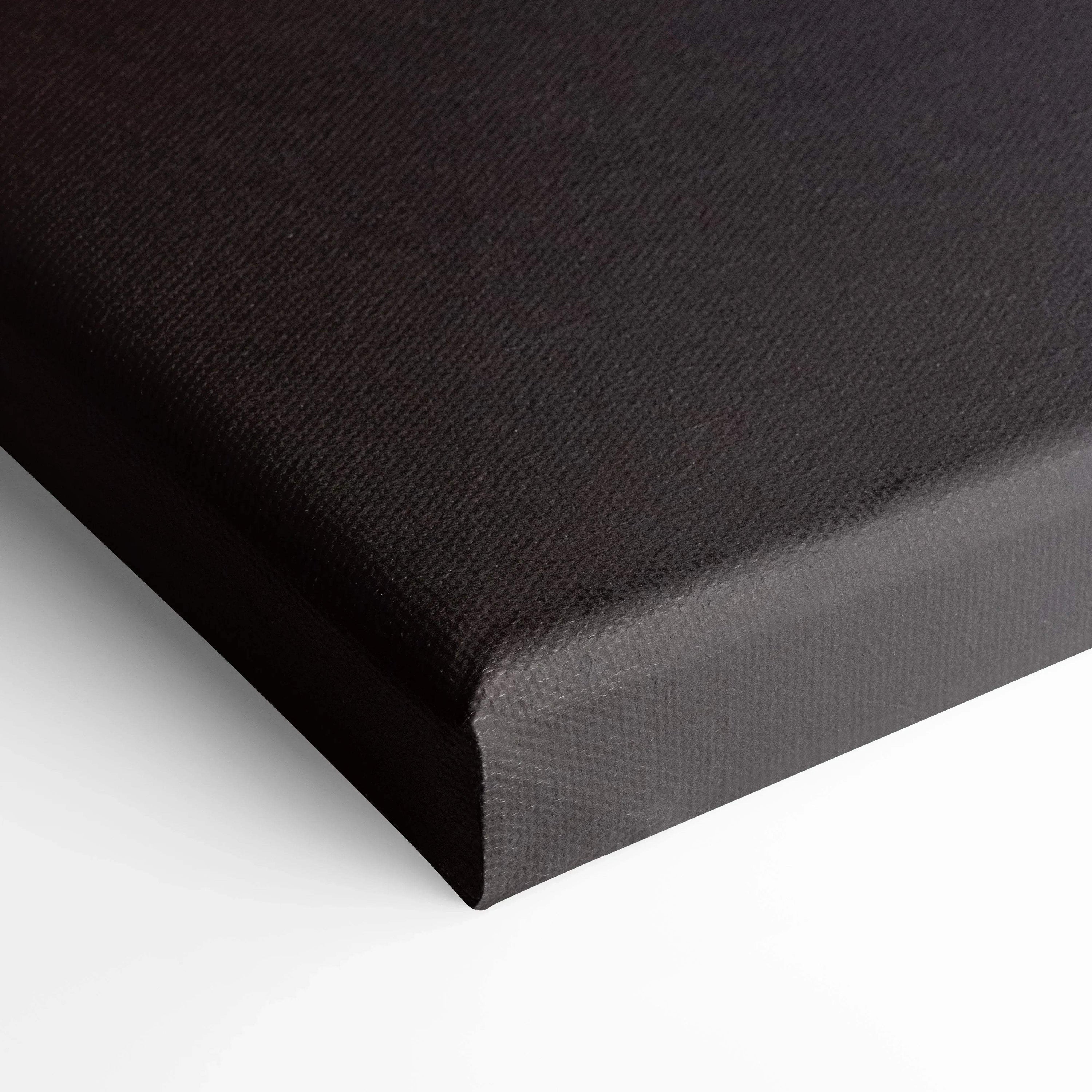 Close-up of black gallery-wrapped canvas corner showcasing textured canvas art for wall art display.
