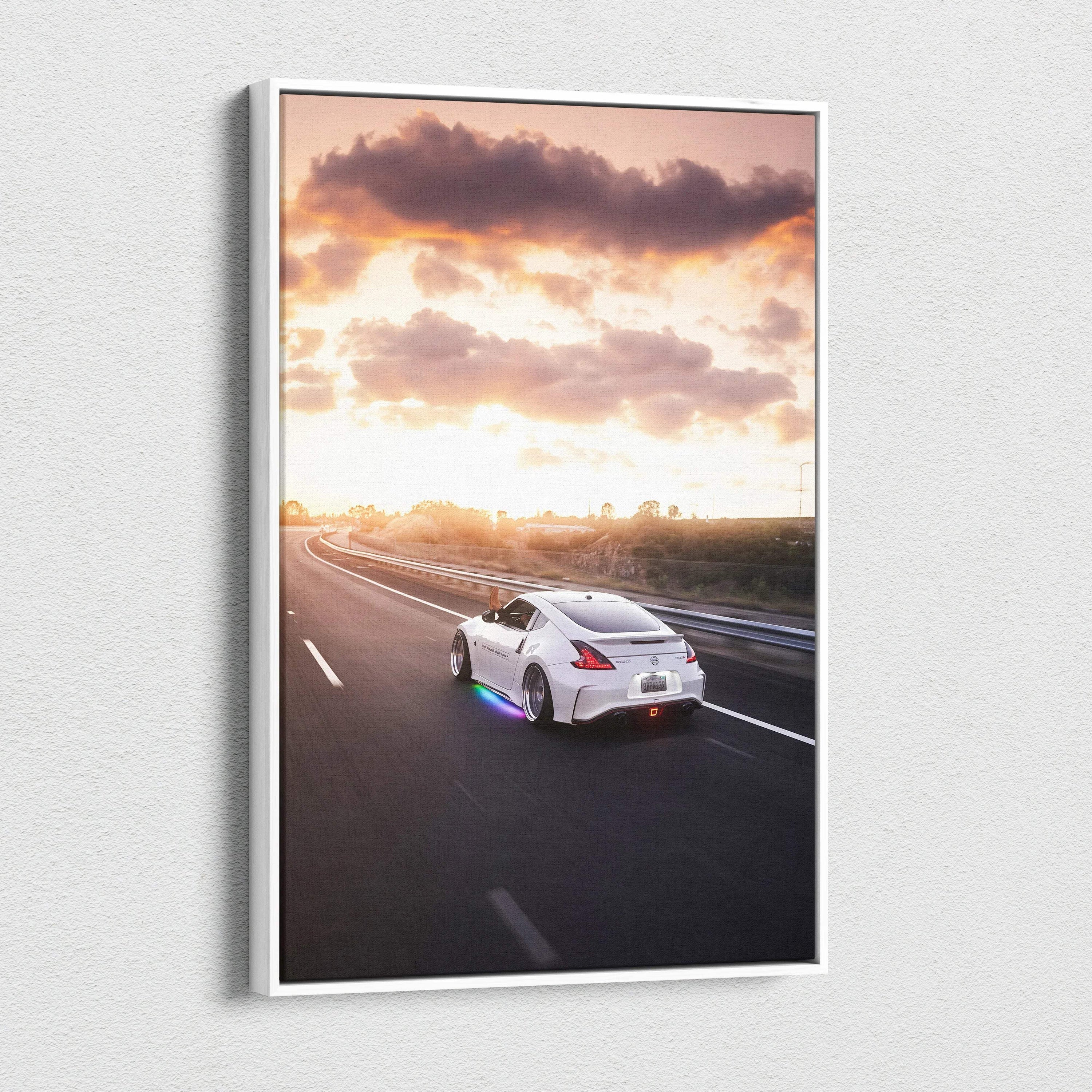 Nissan 370z driving on sunset highway vertical canvas wall art with dramatic sky.