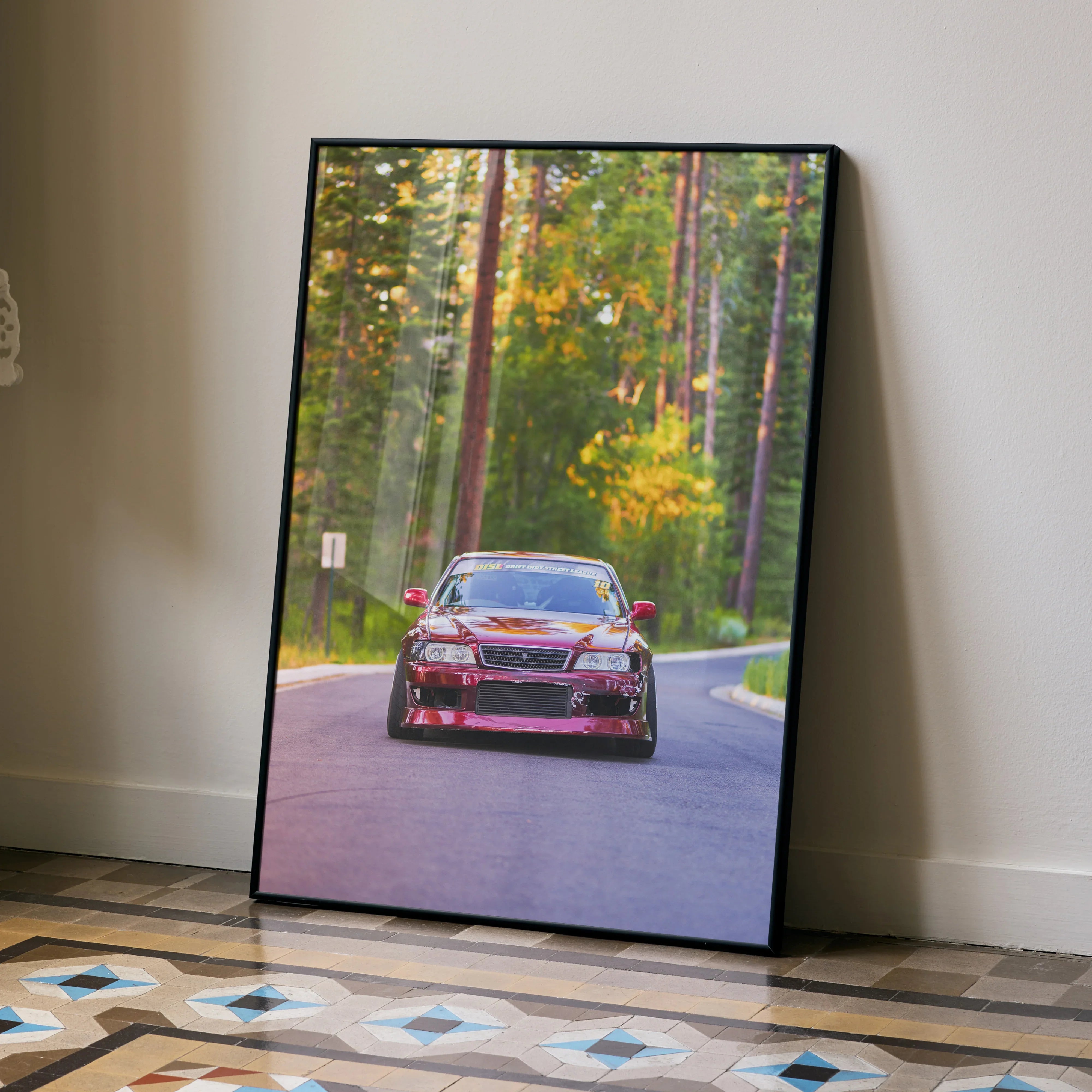 Toyota Chaser JDM drift car driving on forest road wall art poster in black frame.
