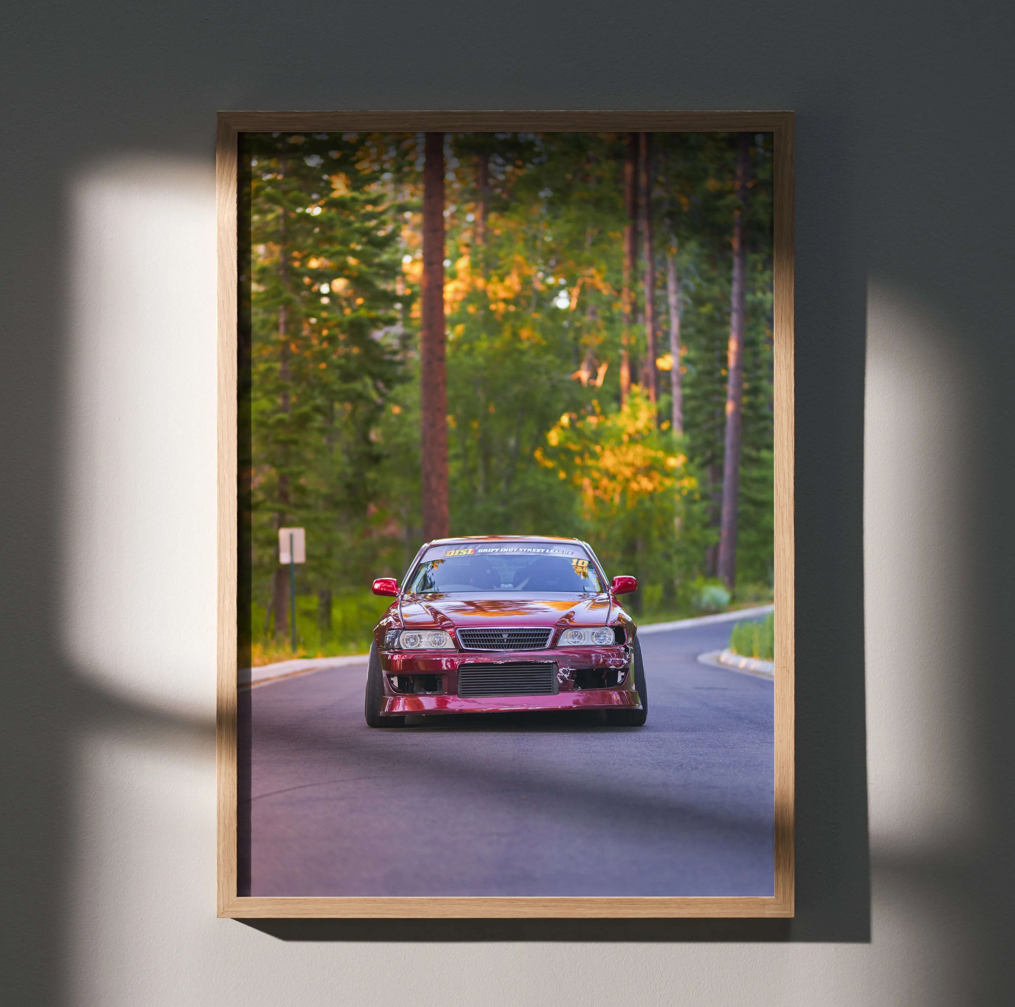 Toyota Chaser JDM drift car poster with red sports car on winding forest road wall art.