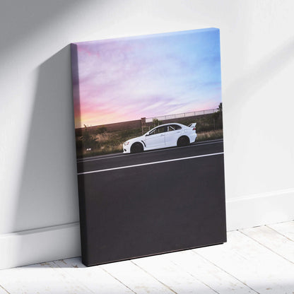 Mitsubishi Evo 10 white sports car on road at sunset canvas wall art.