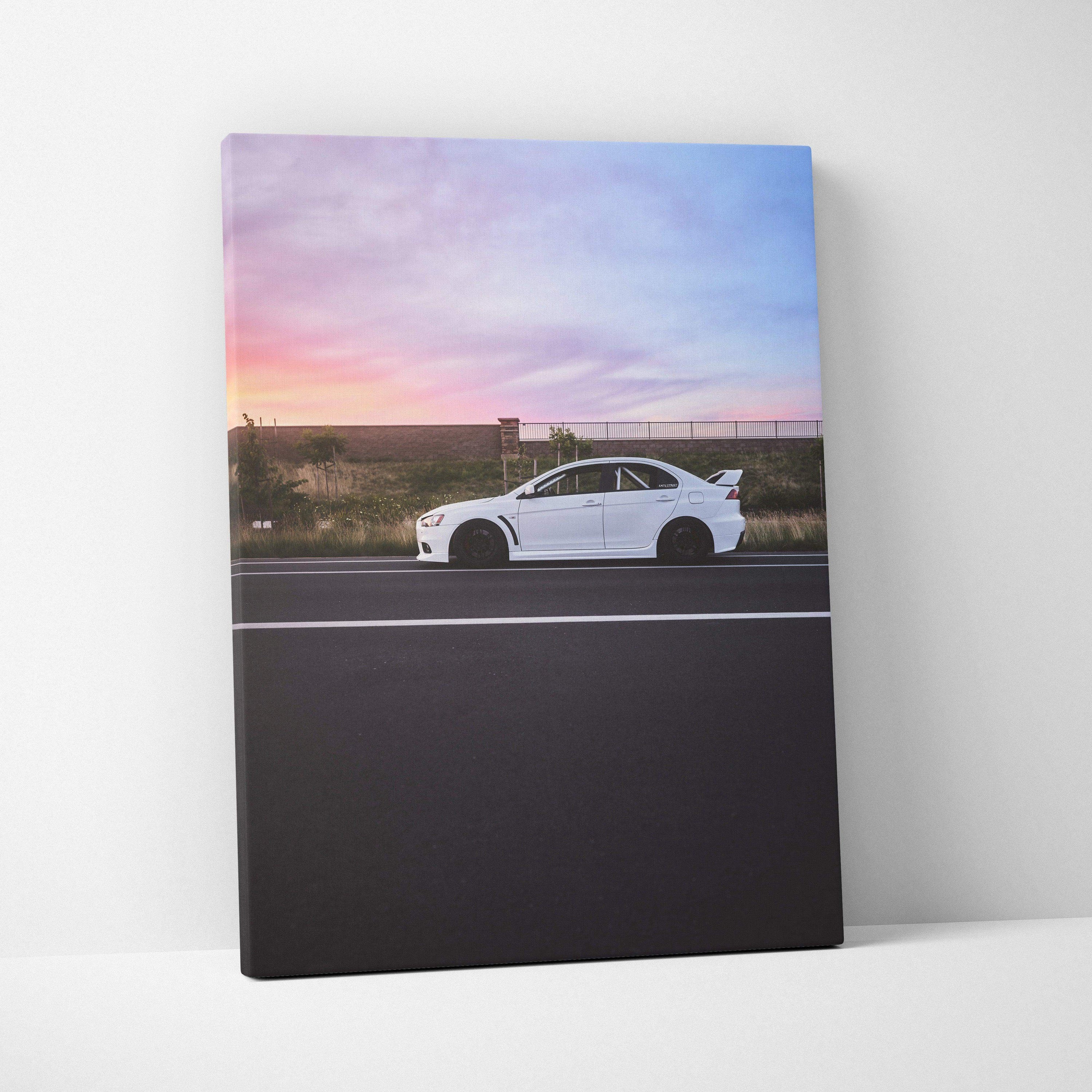 Vertical Mitsubishi Evo 10 canvas art with white car and sunset sky, wall art print.
