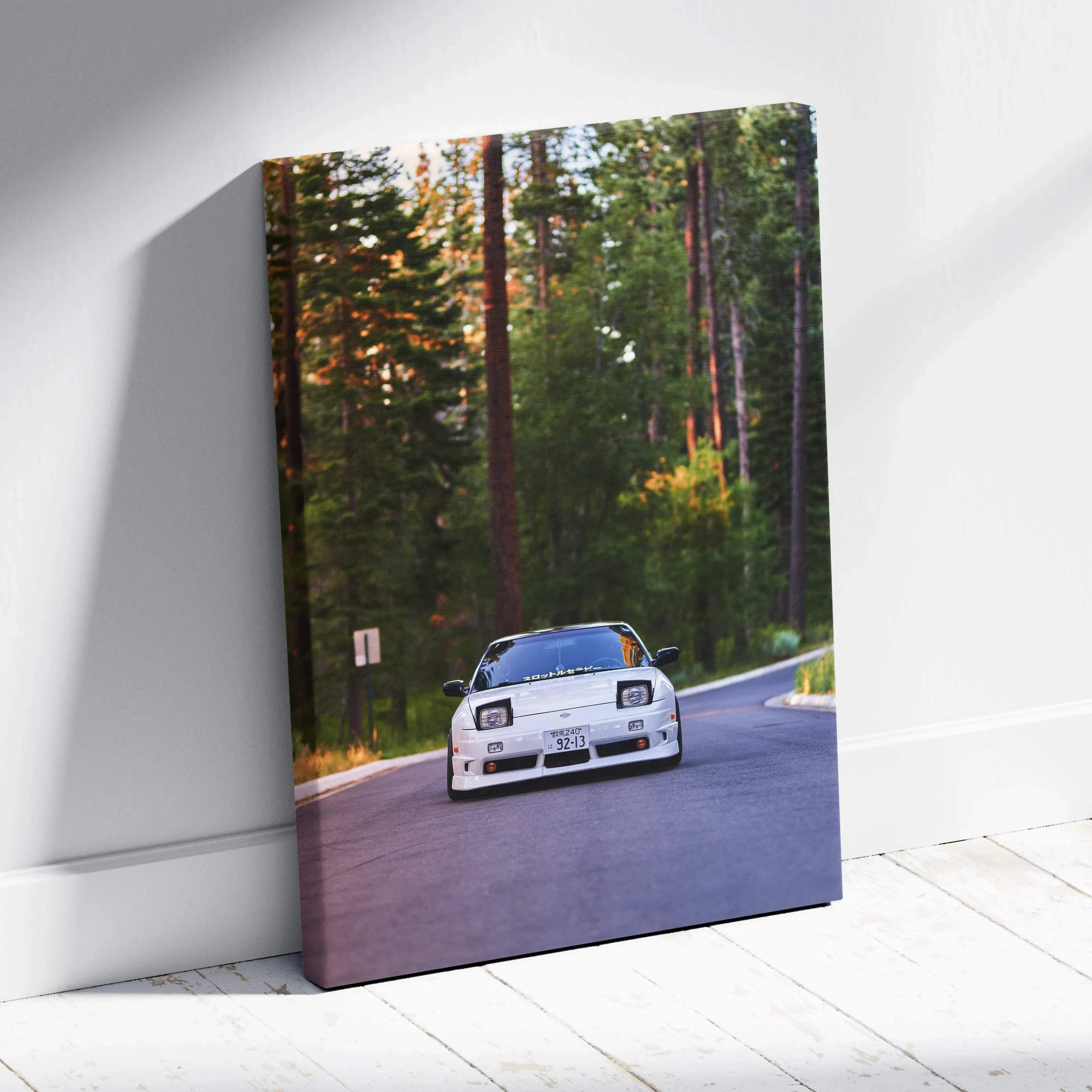 Vertical canvas art of a white Nissan 240sx driving on forest road wall art.