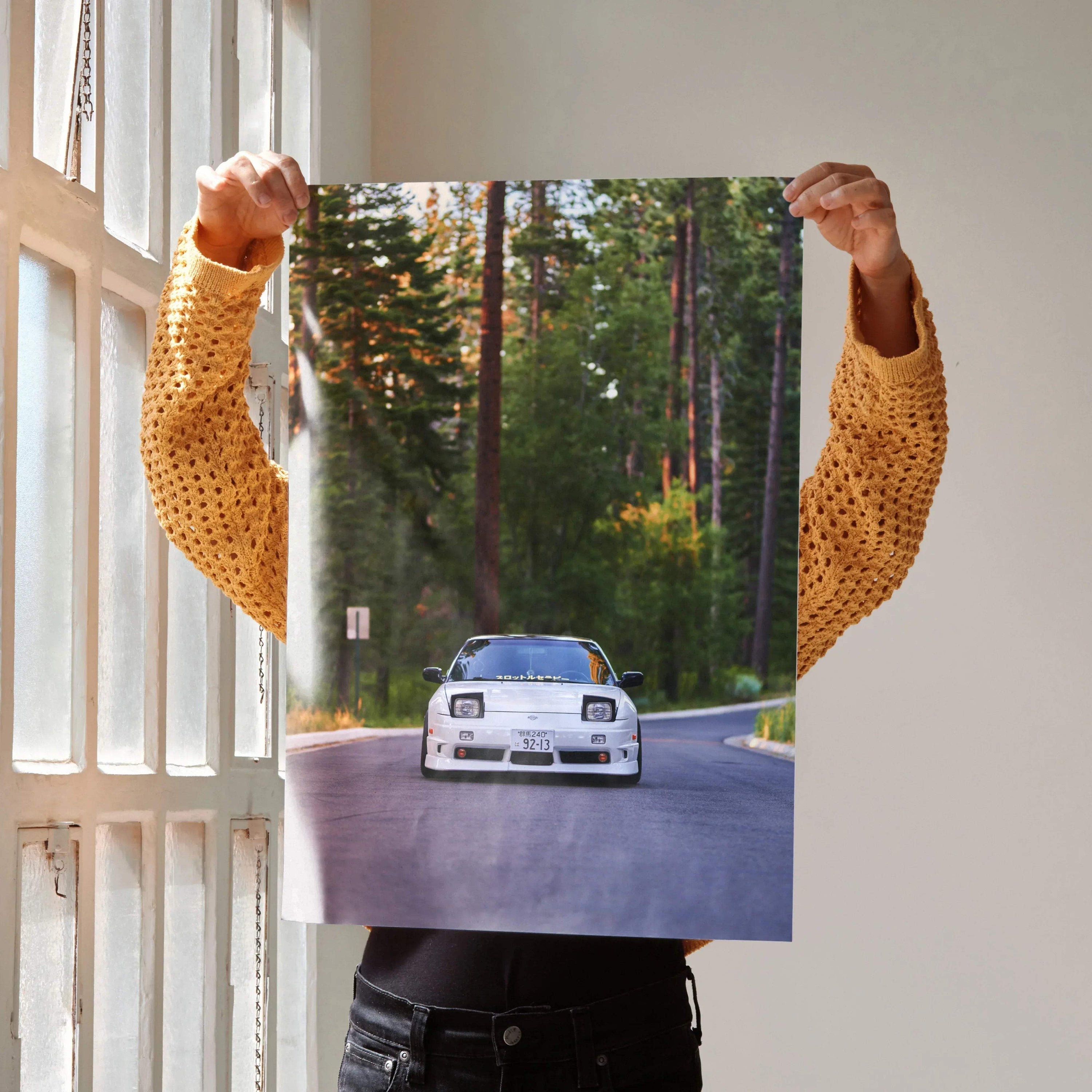 Nissan 240sx S13 Type-X poster showing front view of white car on forest road wall art.