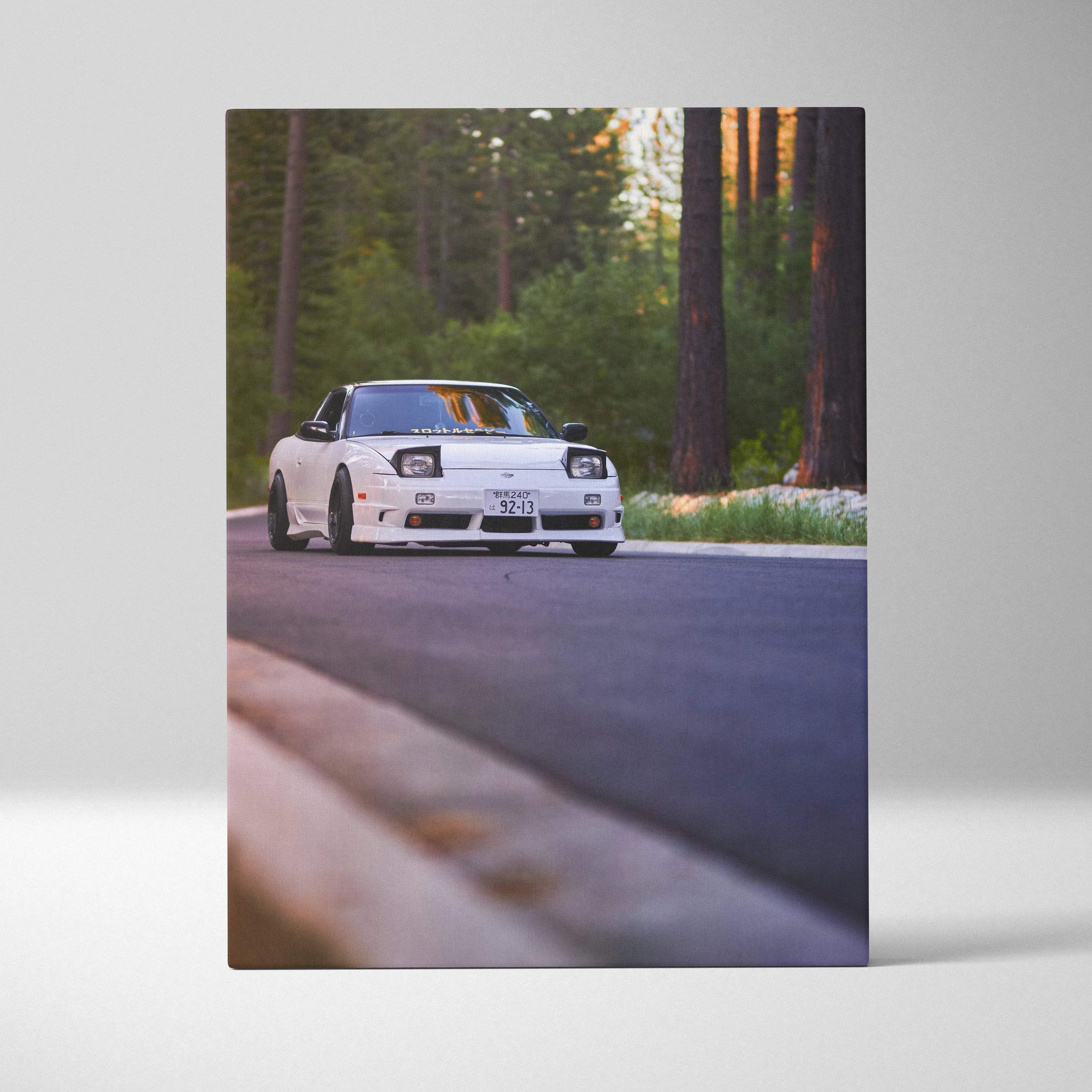 White Nissan 240sx Type X on forest road canvas wall art with vertical layout.
