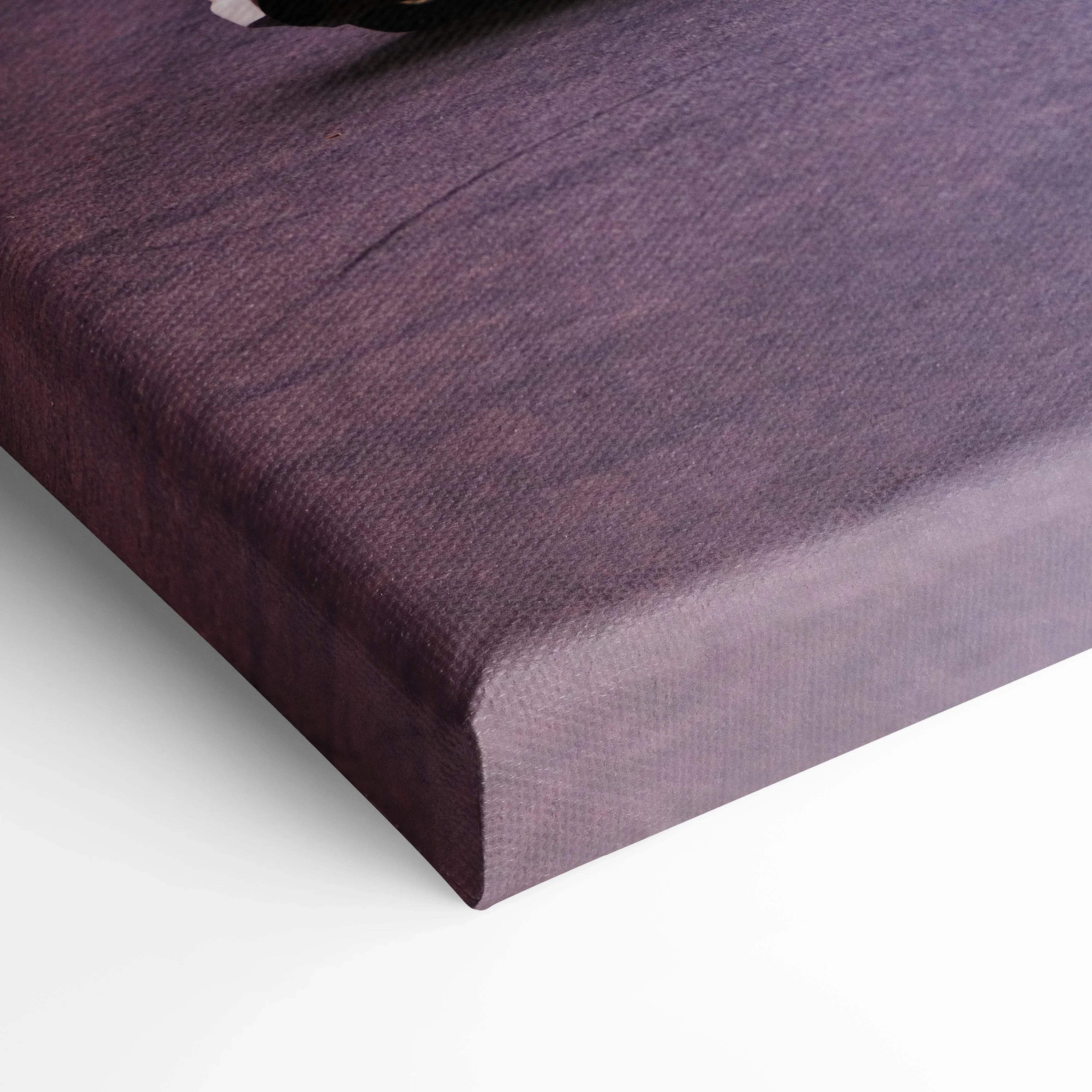 Close-up of textured canvas edge in dark purple wall art canvas print.