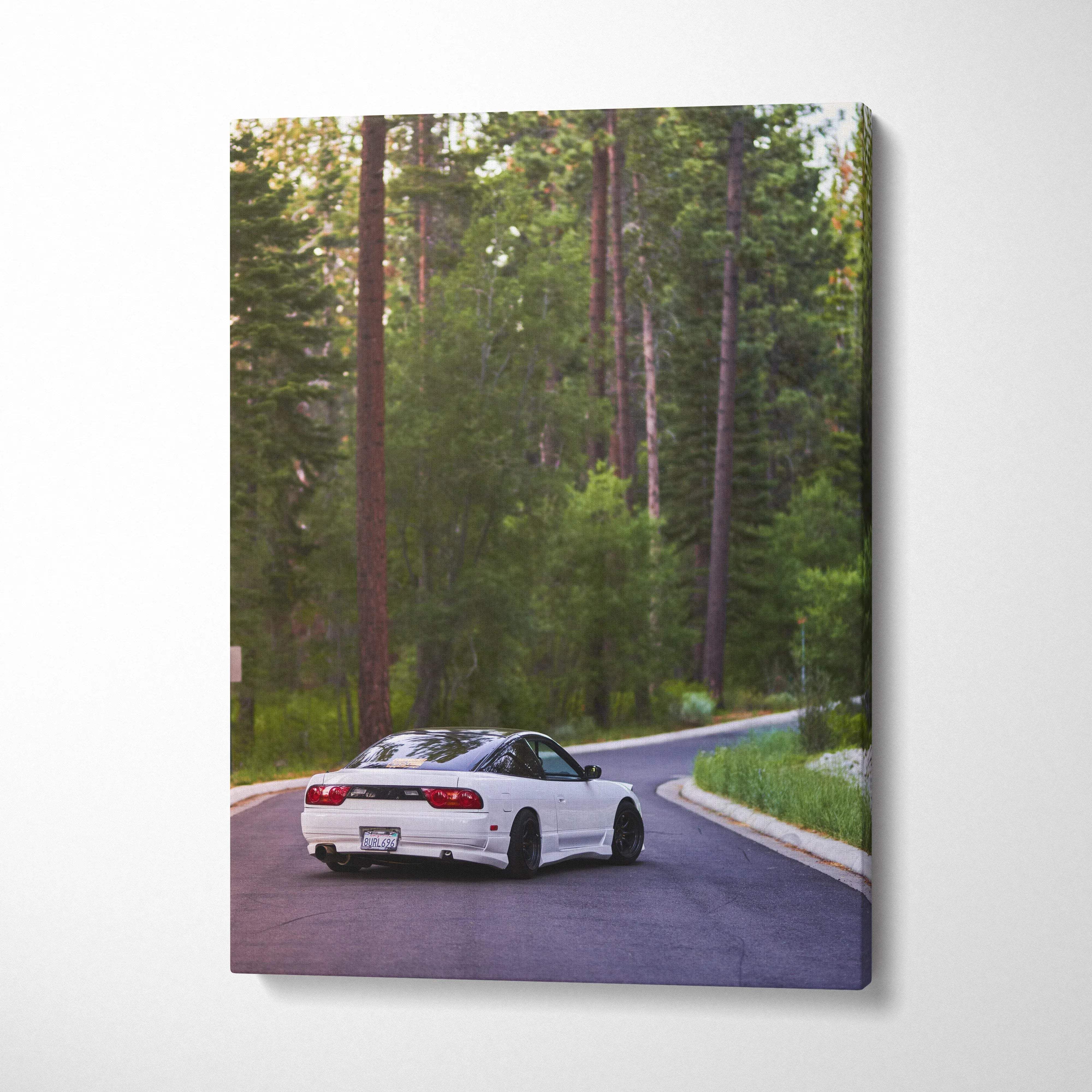 White Nissan 240sx Type X driving on forest road canvas wall art in vertical format.