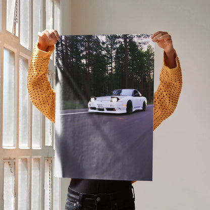 Poster wall art featuring a white Nissan 240sx S13 Type-X driving on a forest road at sunset.