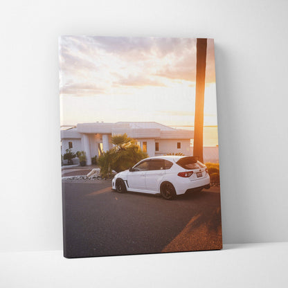 White Subaru WRX STI parked on street at sunset canvas wall art print.