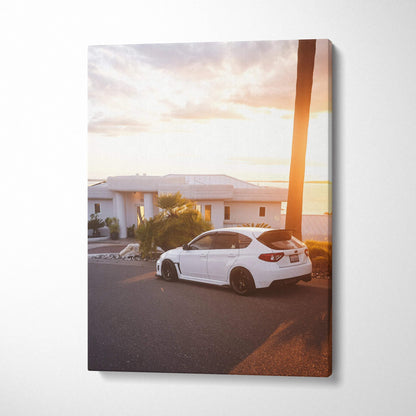 Subaru WRX STI white car parked by palm tree at sunset vertical canvas wall art.