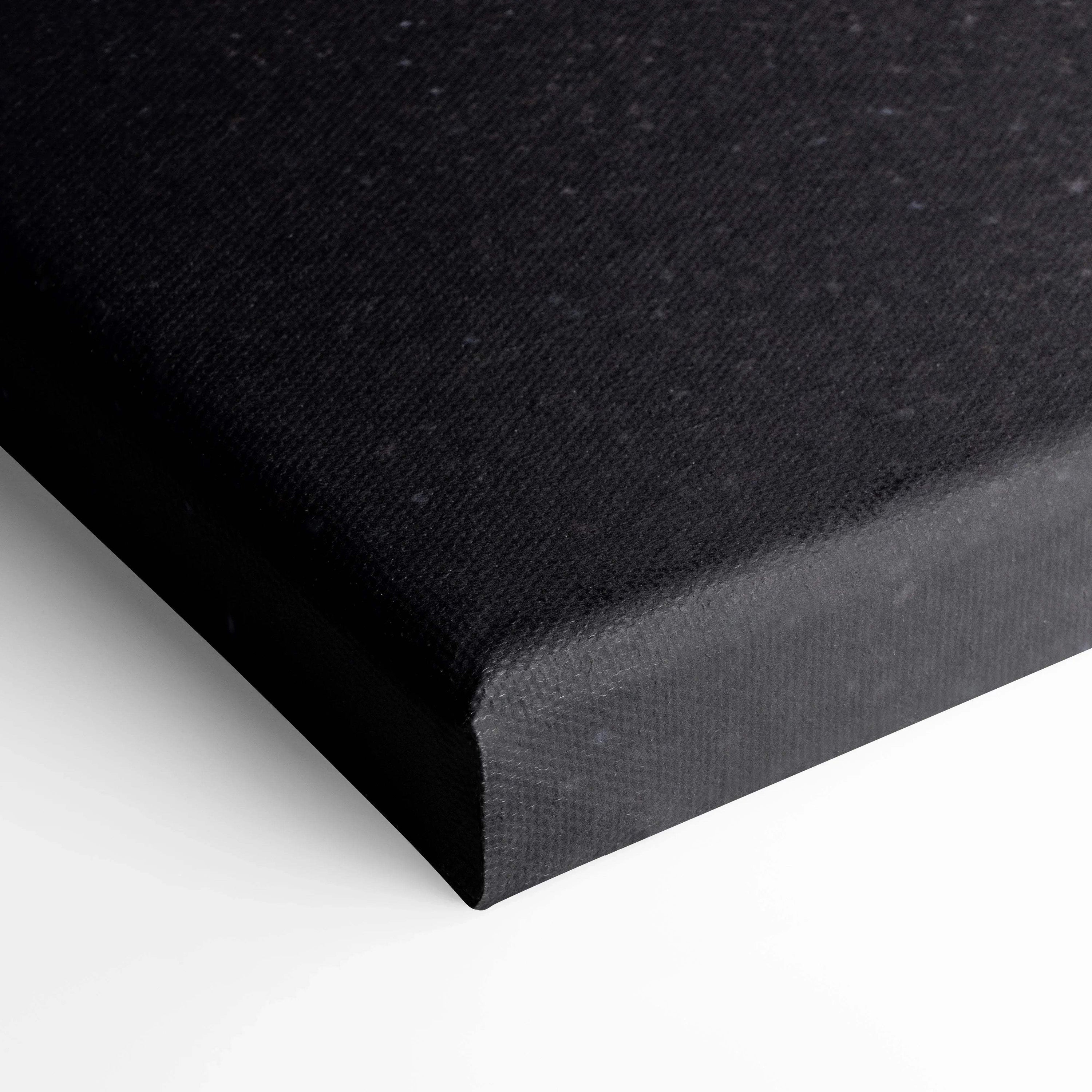 Black textured canvas corner showcasing museum-quality wall art with clean wrapped edges.