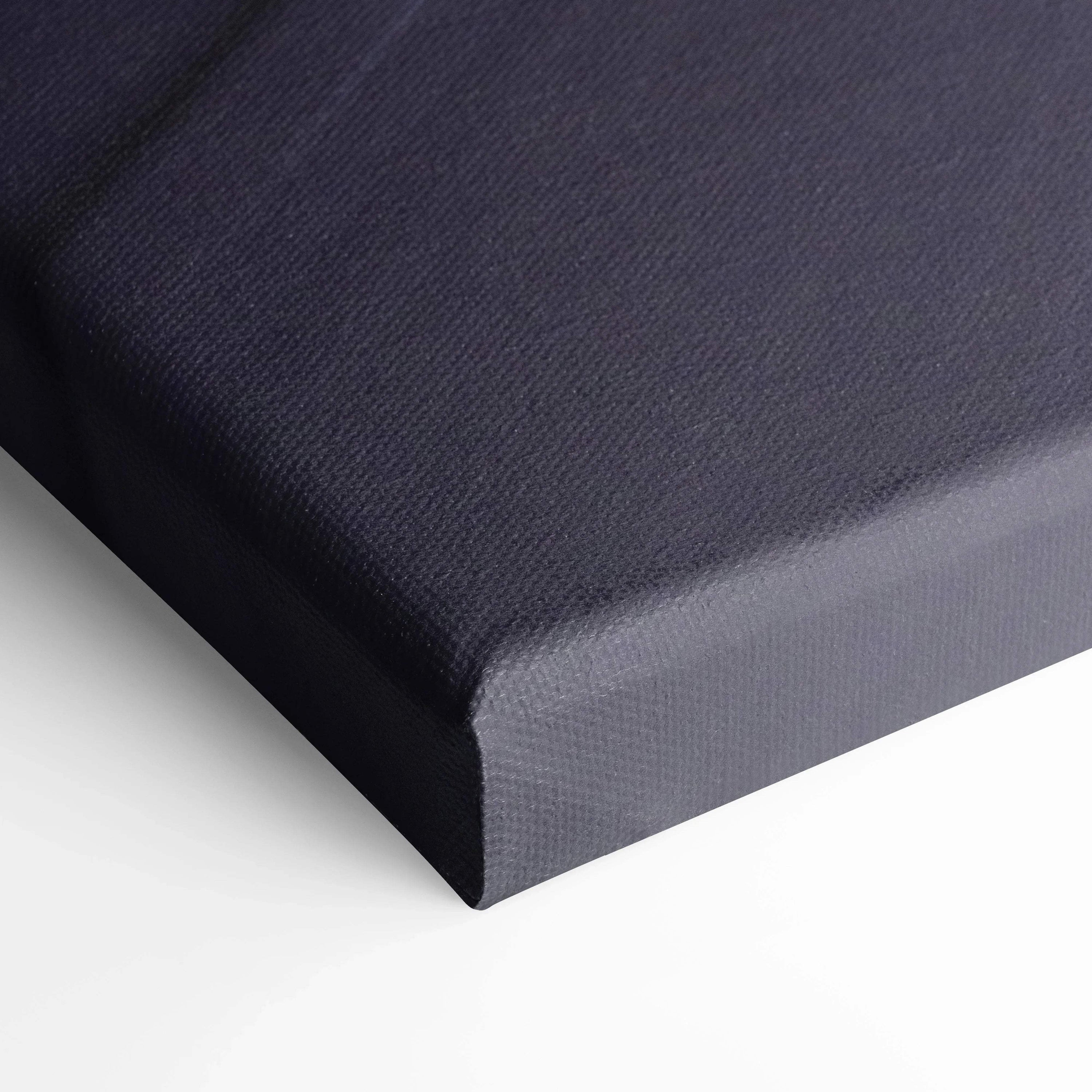 Close-up of black gallery-wrapped canvas with textured surface for wall art and canvas art display.
