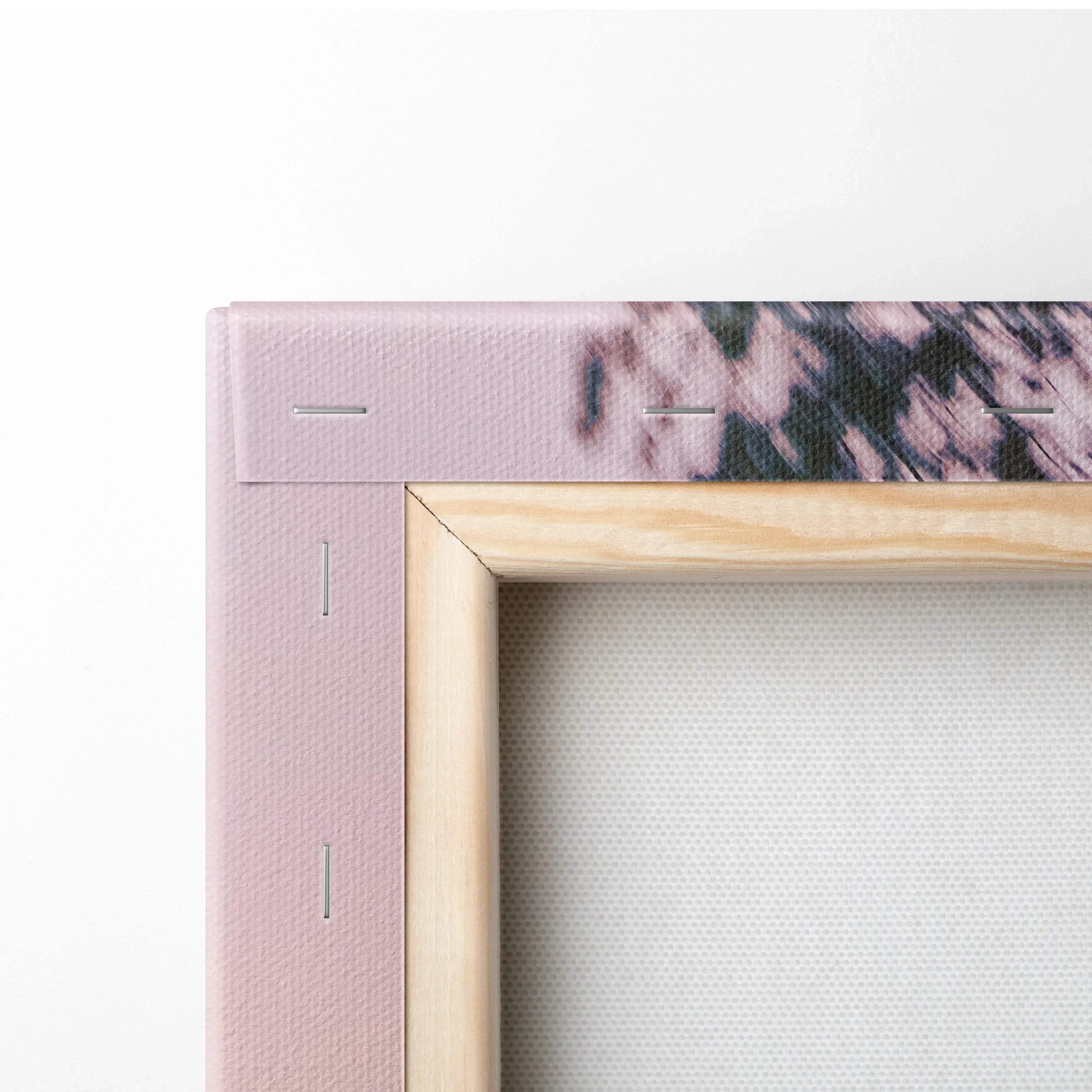 Close-up of wooden-framed canvas wall art corner with visible staples and textured canvas surface.