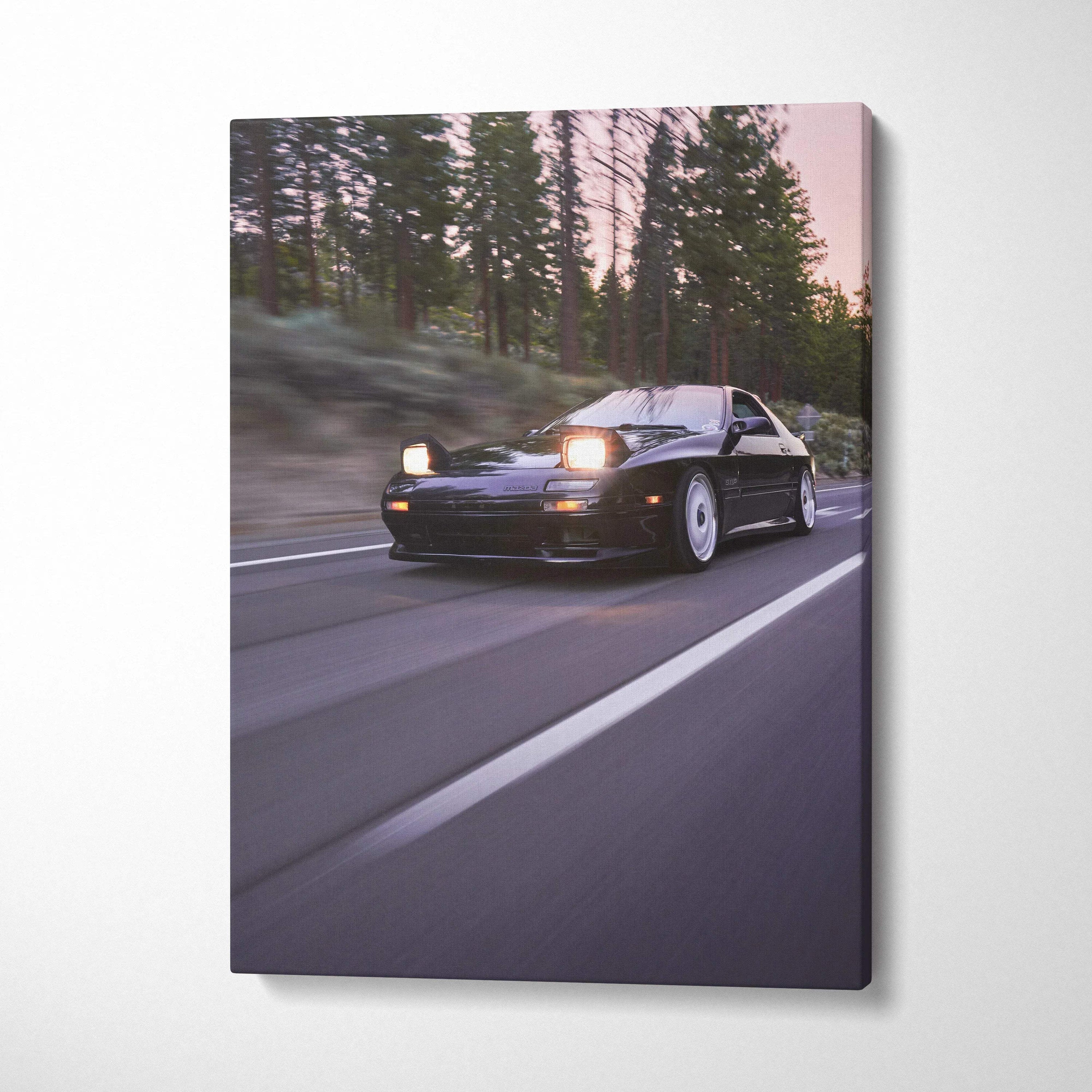 Mazda FC RX7 car speeding on forest road canvas wall art in vertical format.