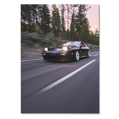 Mazda FC RX7 driving on road at dusk with headlights on poster wall art.