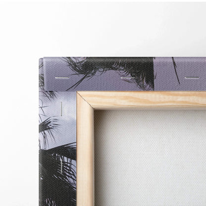 Corner close-up of wired vertical canvas wall art with pale wood frame and printed black and white design.