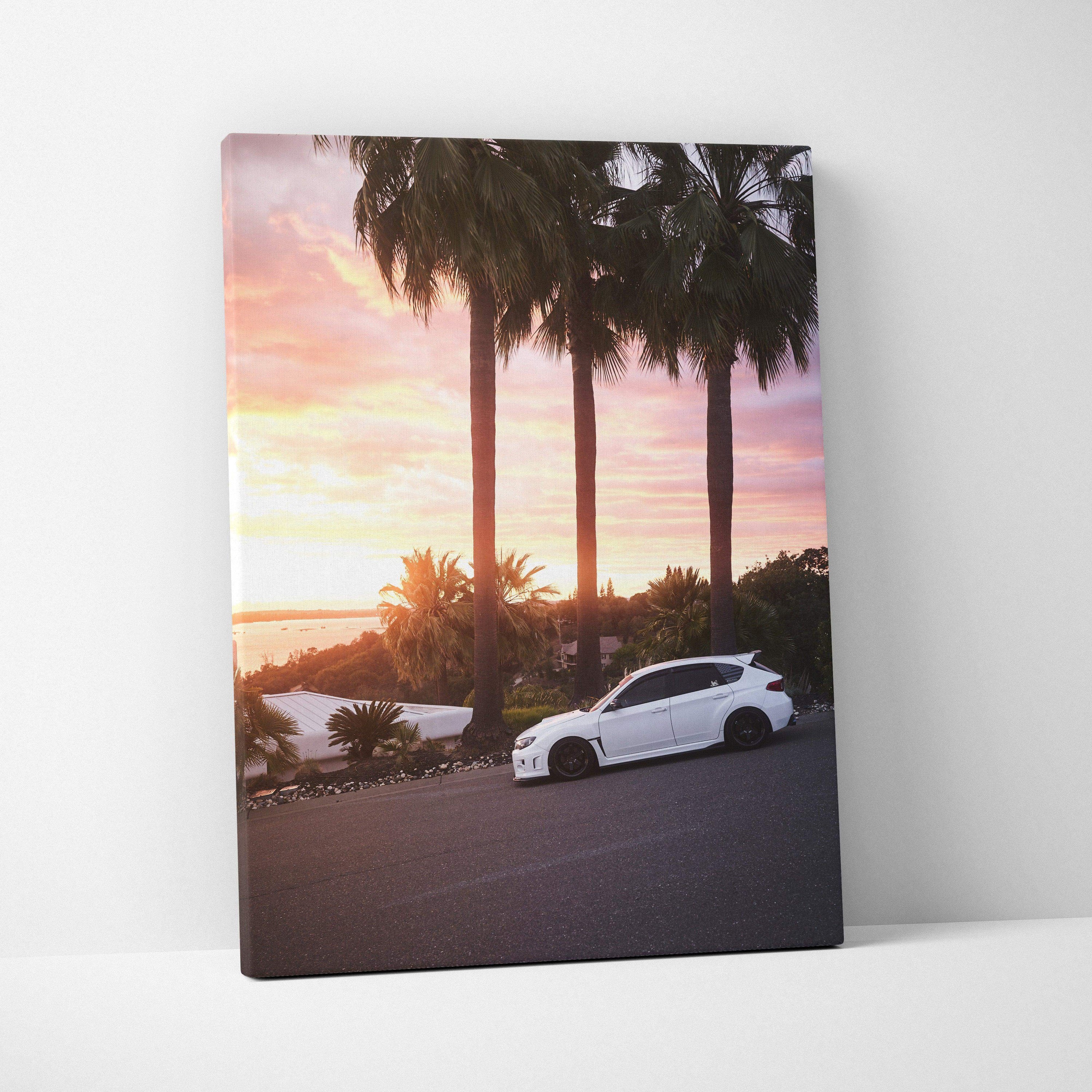 Subaru WRX STI parked by palm trees at sunset canvas wall art vertical print.