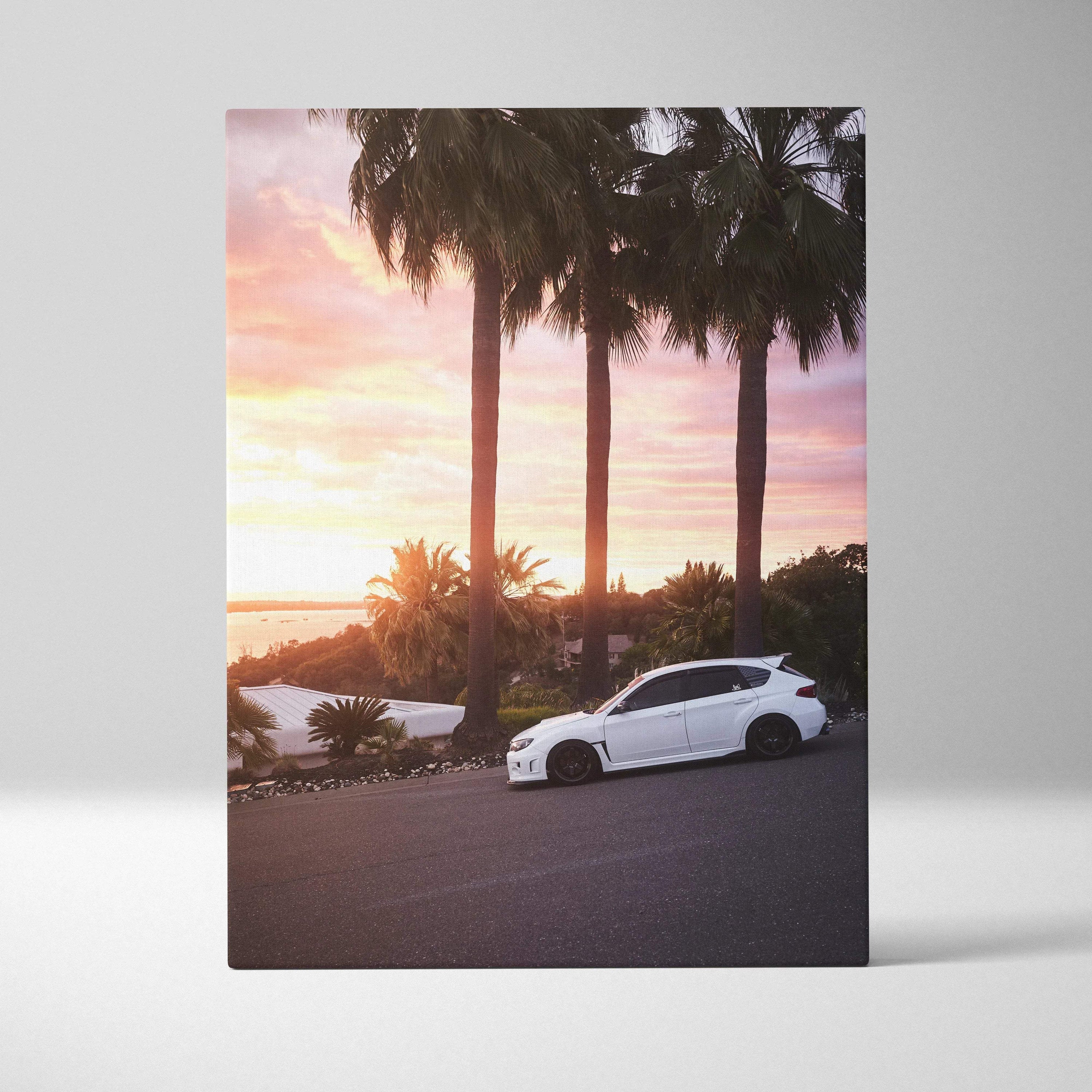 Subaru WRX STI parked on hill at sunset with palm trees canvas wall art.