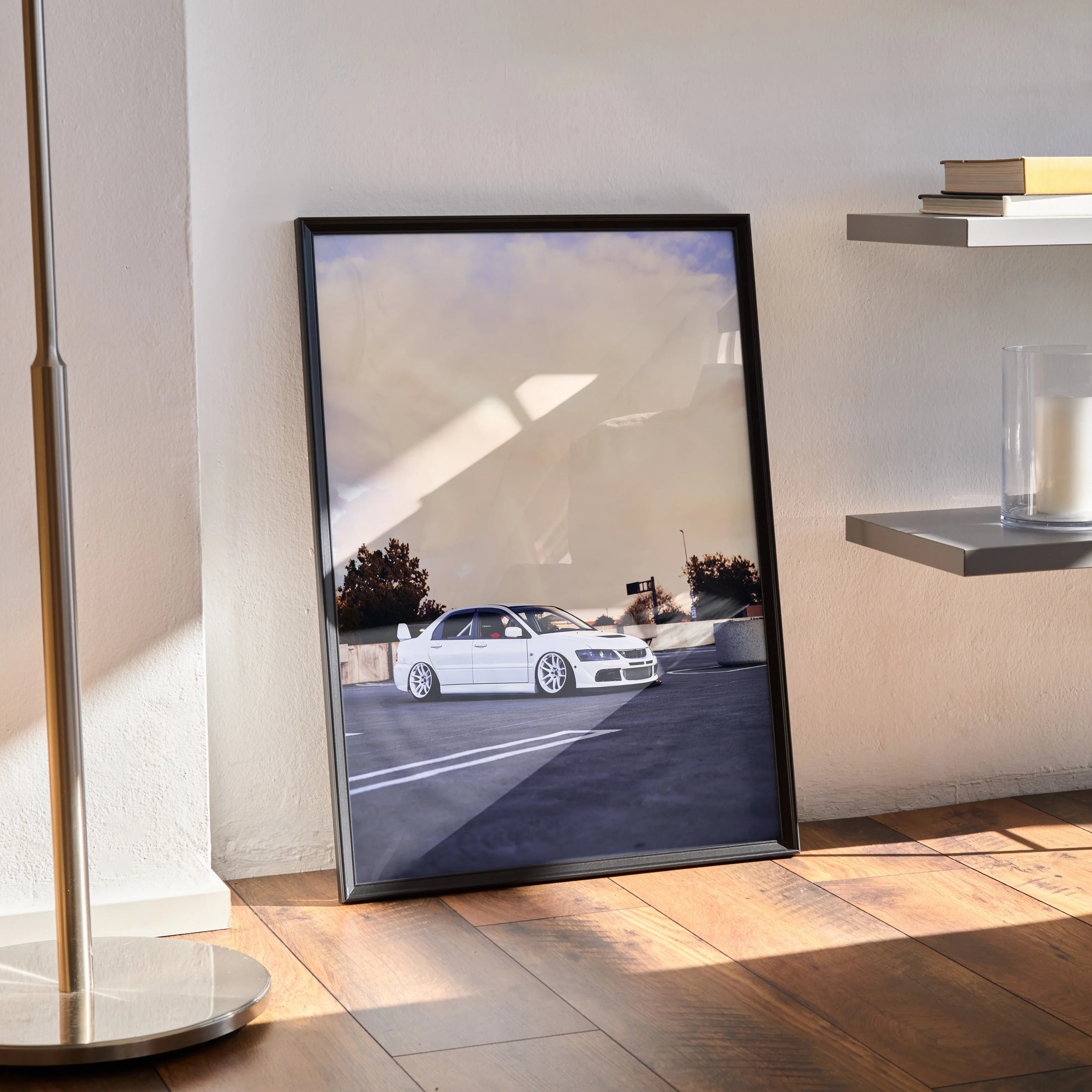 Mitsubishi Evo 8 poster wall art with white car in parking lot at sunset, black frame.