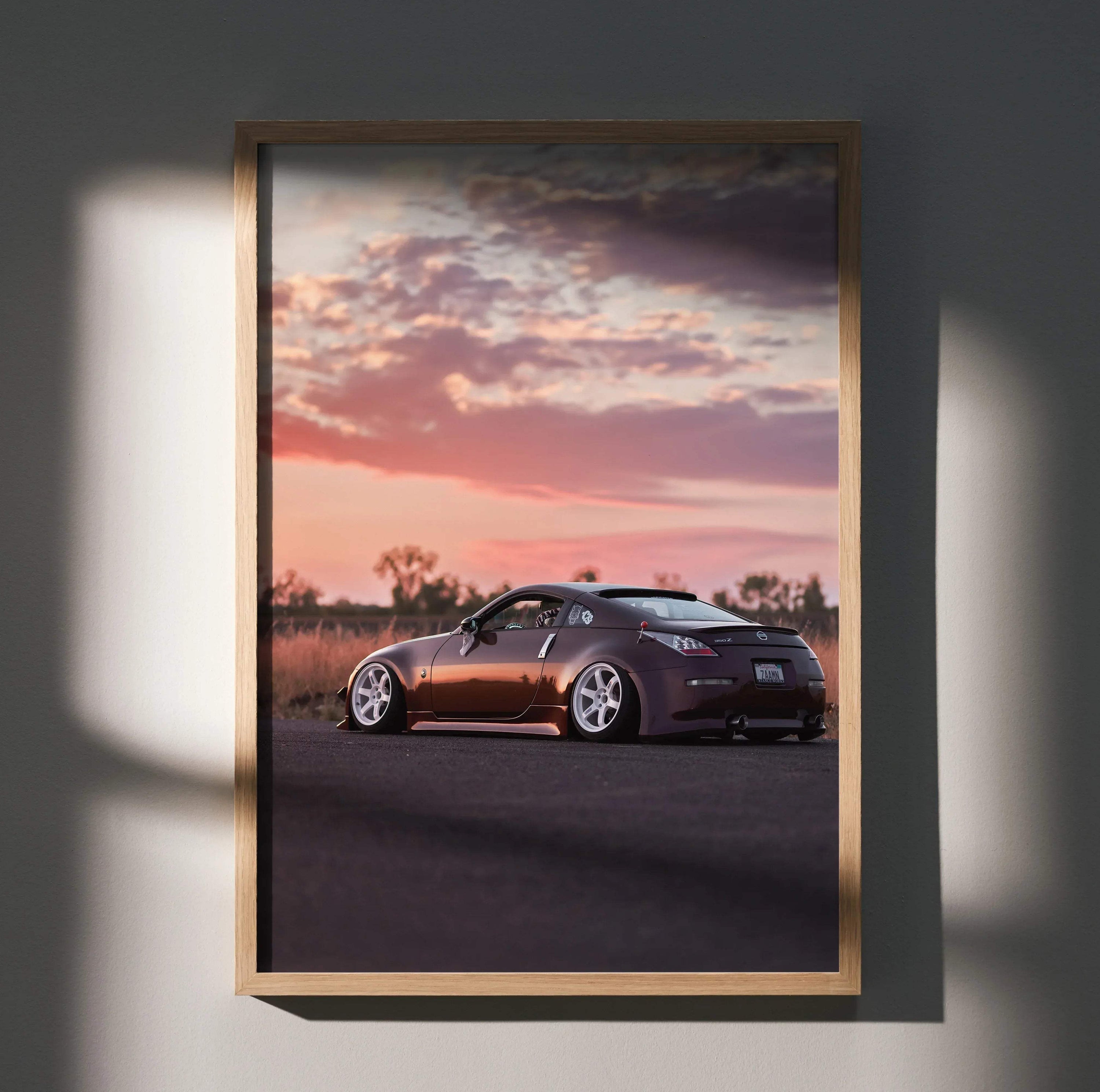 Nissan 350z car poster with sunset sky, sleek design, and dark tones wall art.
