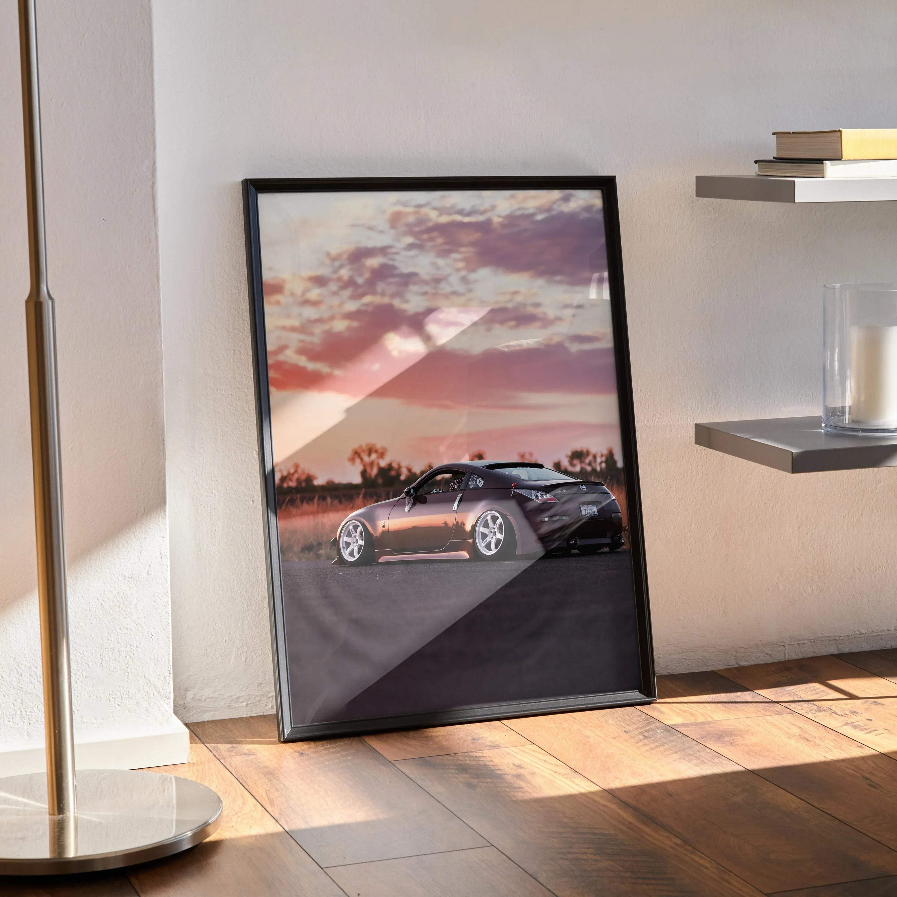 Nissan 350z car poster with sunset background, sleek silver sports car wall art in black frame.