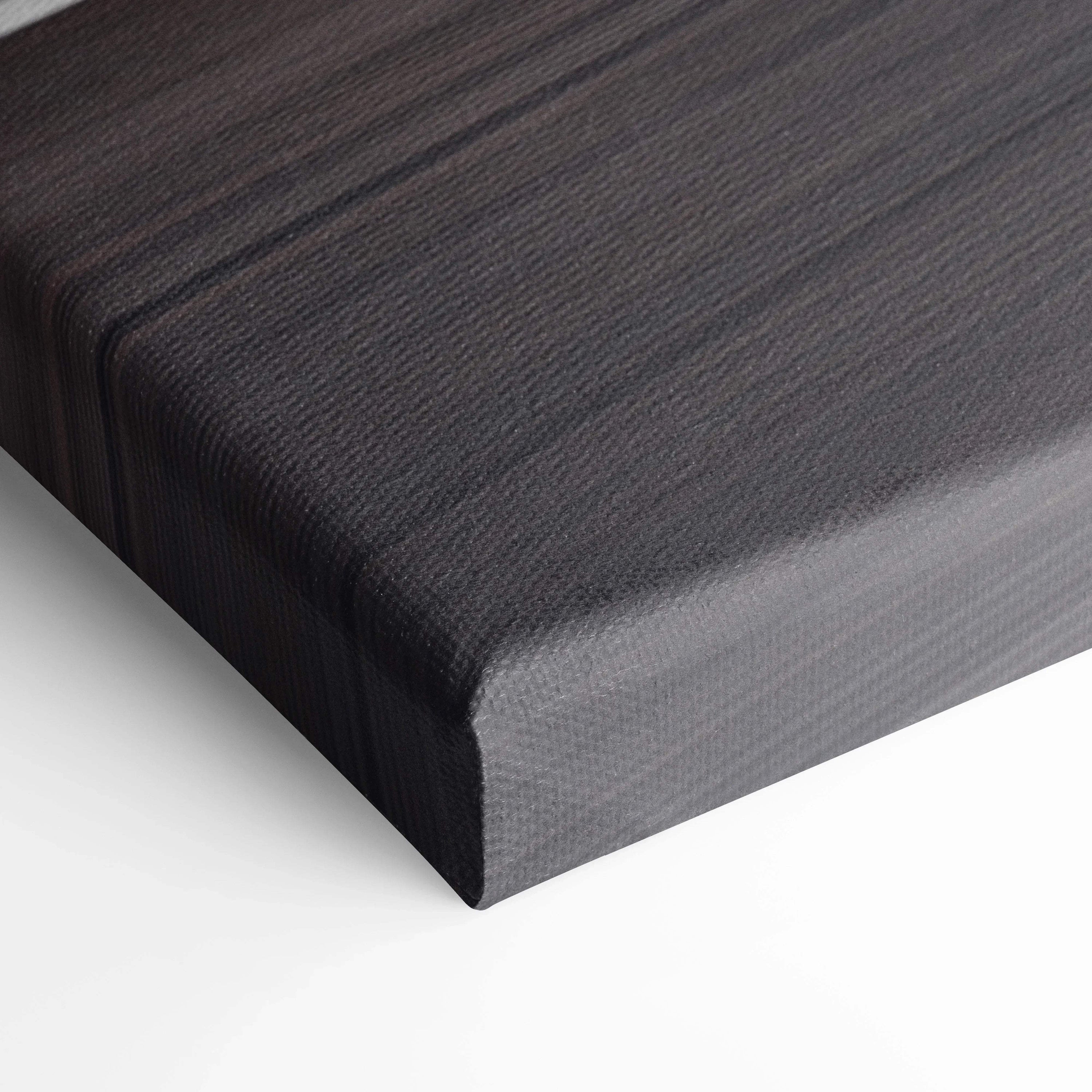 Close-up of textured black canvas corner showcasing premium material for wall art and canvas art prints.
