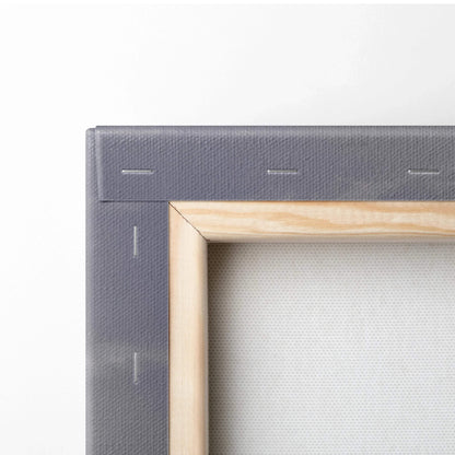 Close-up of wooden stretcher frame and stapled edge on blank canvas for wall art or canvas art background.