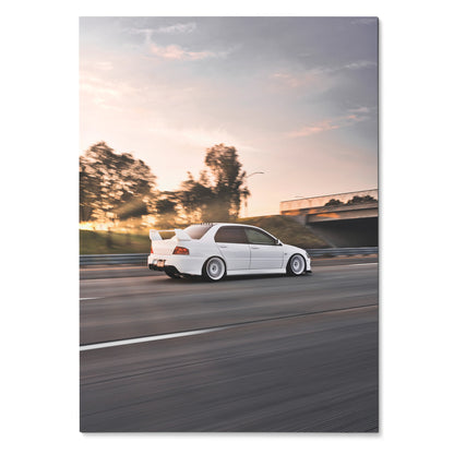 White Mitsubishi Evo 8 driving on highway at sunset poster wall art with blurred motion background.